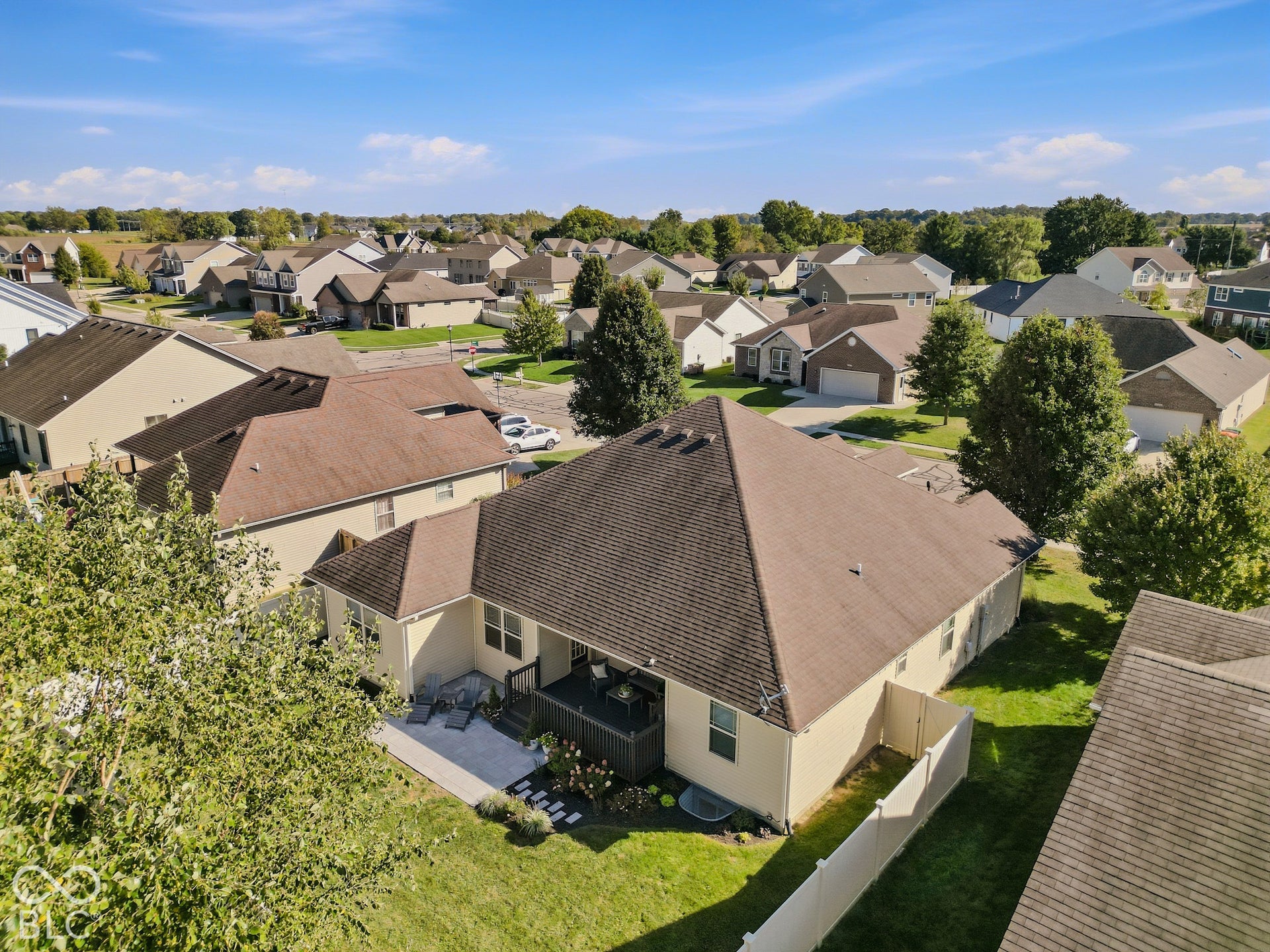 2656 Daffodil Court W, Columbus, IN 47201 Back exterior with covered deck and paver patio