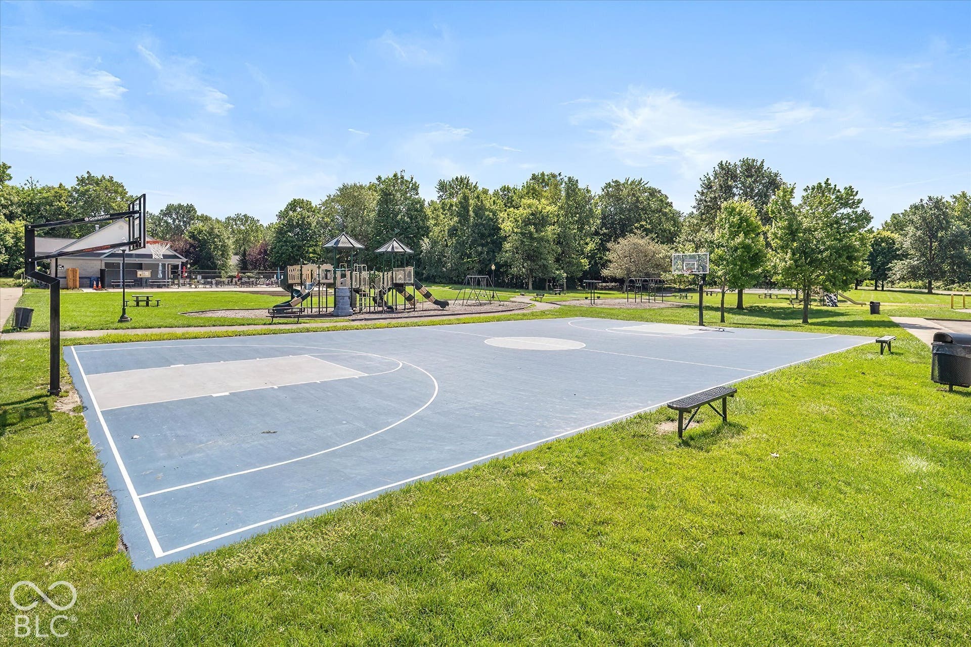 Community Basketball Court:  Light blue surface and white line markings