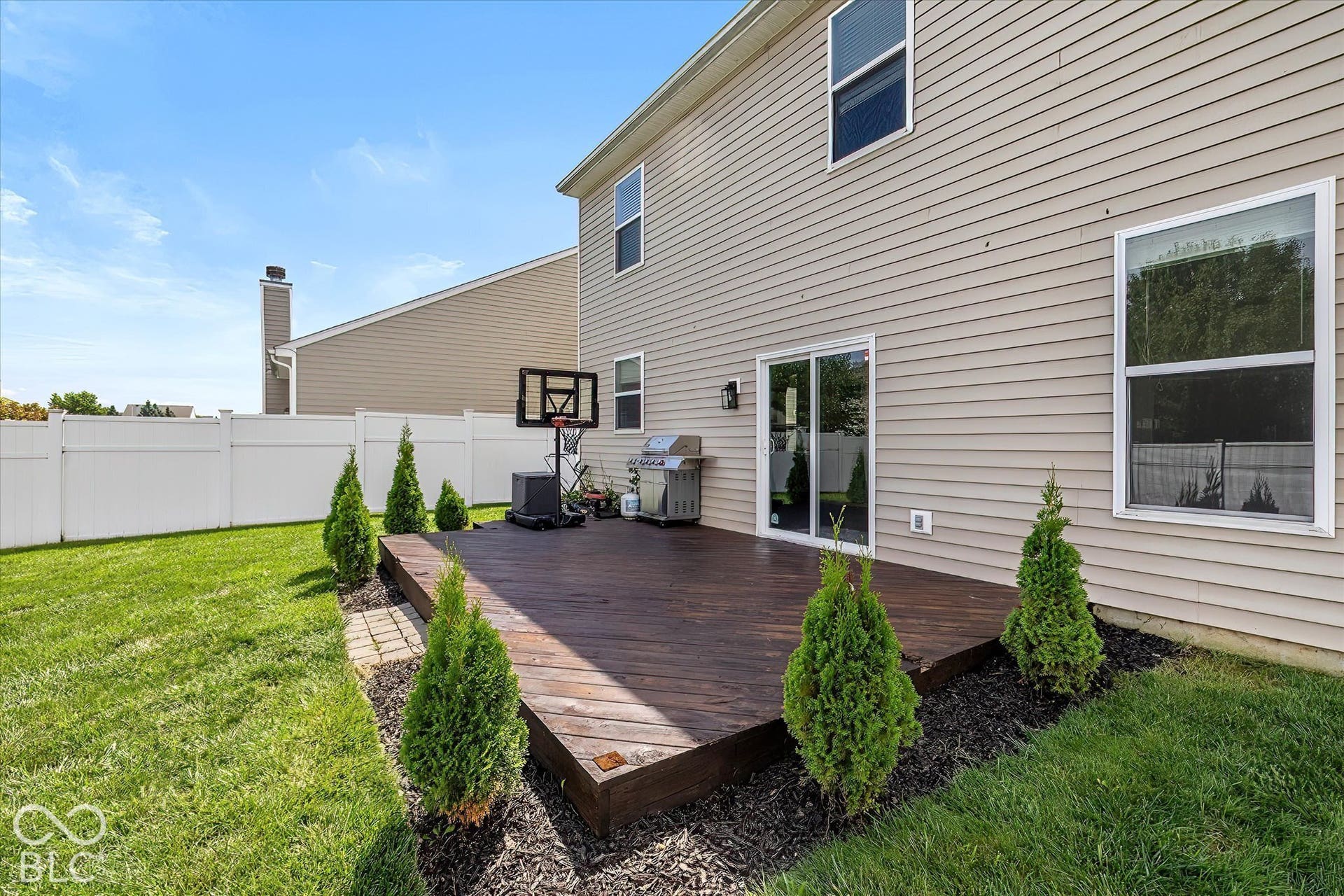 Expansive wood deck with direct access to interior via sliding glass door