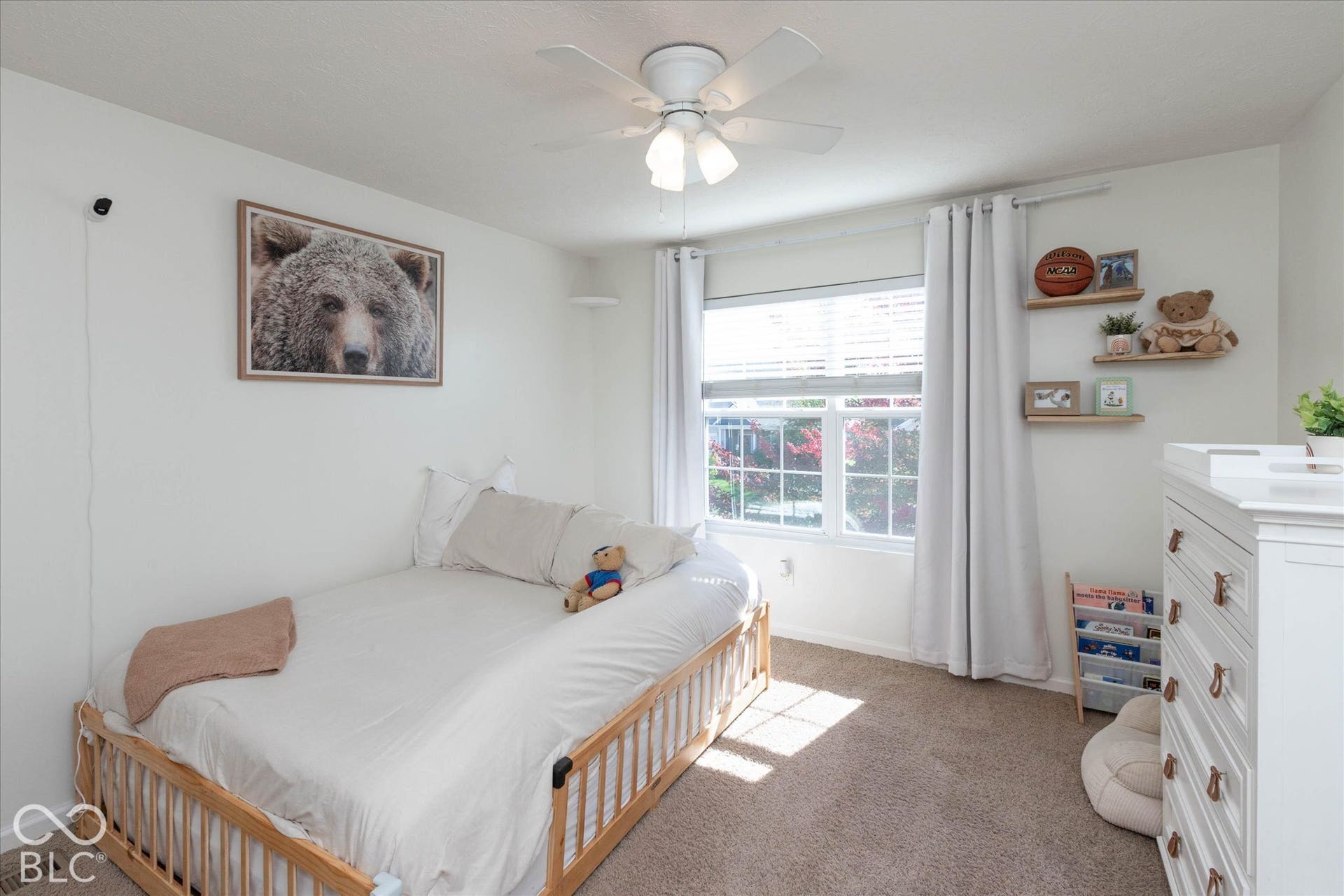 Bedroom #3:  White ceiling fan with integrated lighting, light toned walls, and a window with blinds