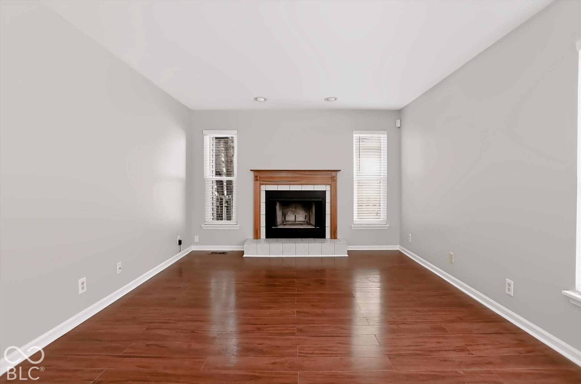 Warm wood-finish flooring complements light-toned walls