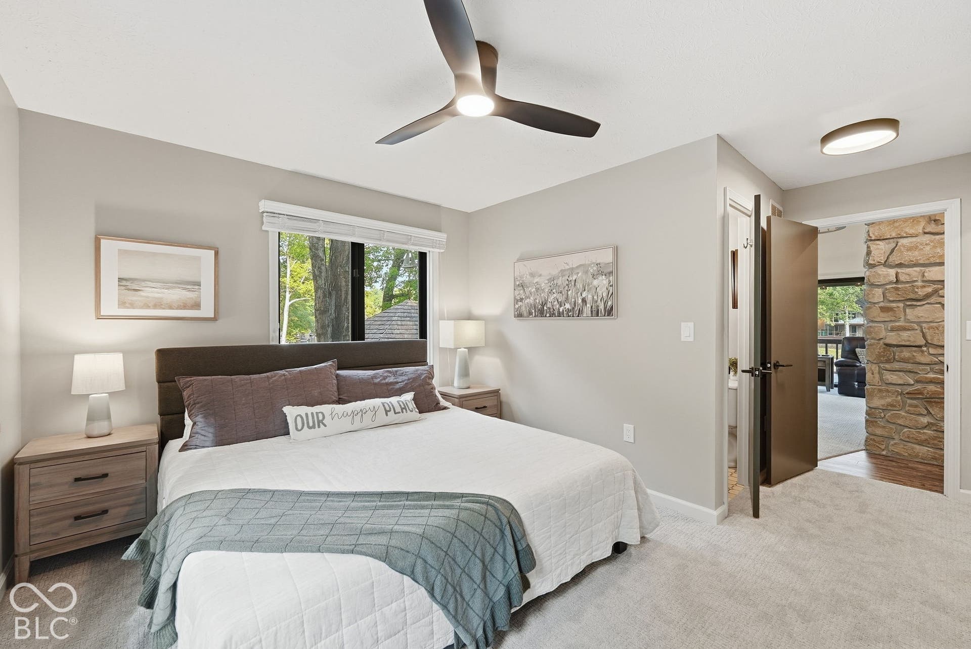 Light gray wall paint, carpet flooring, a ceiling fan with integrated lighting, and a window with blinds