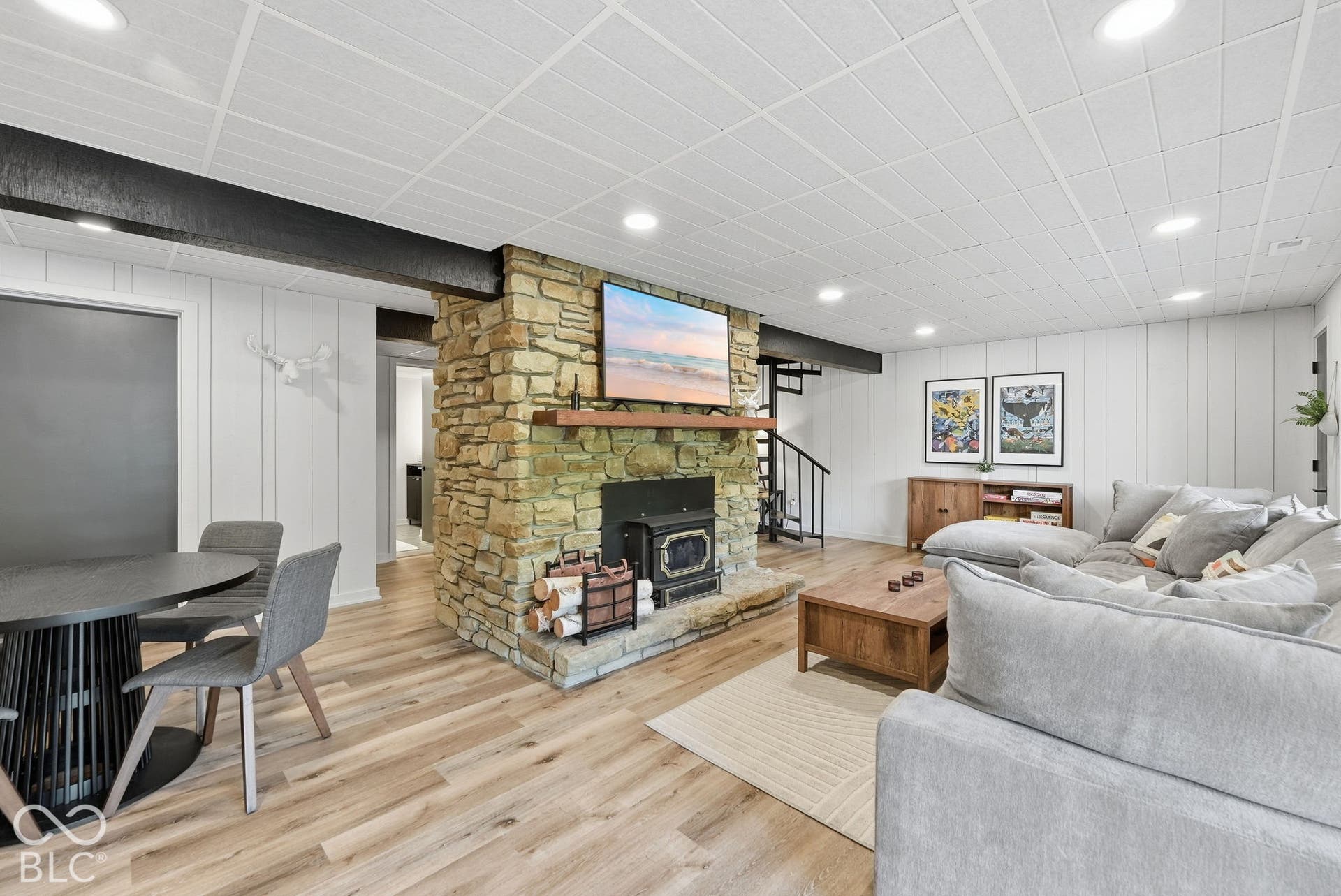 Stone fireplace with wood-burning insert and hearth