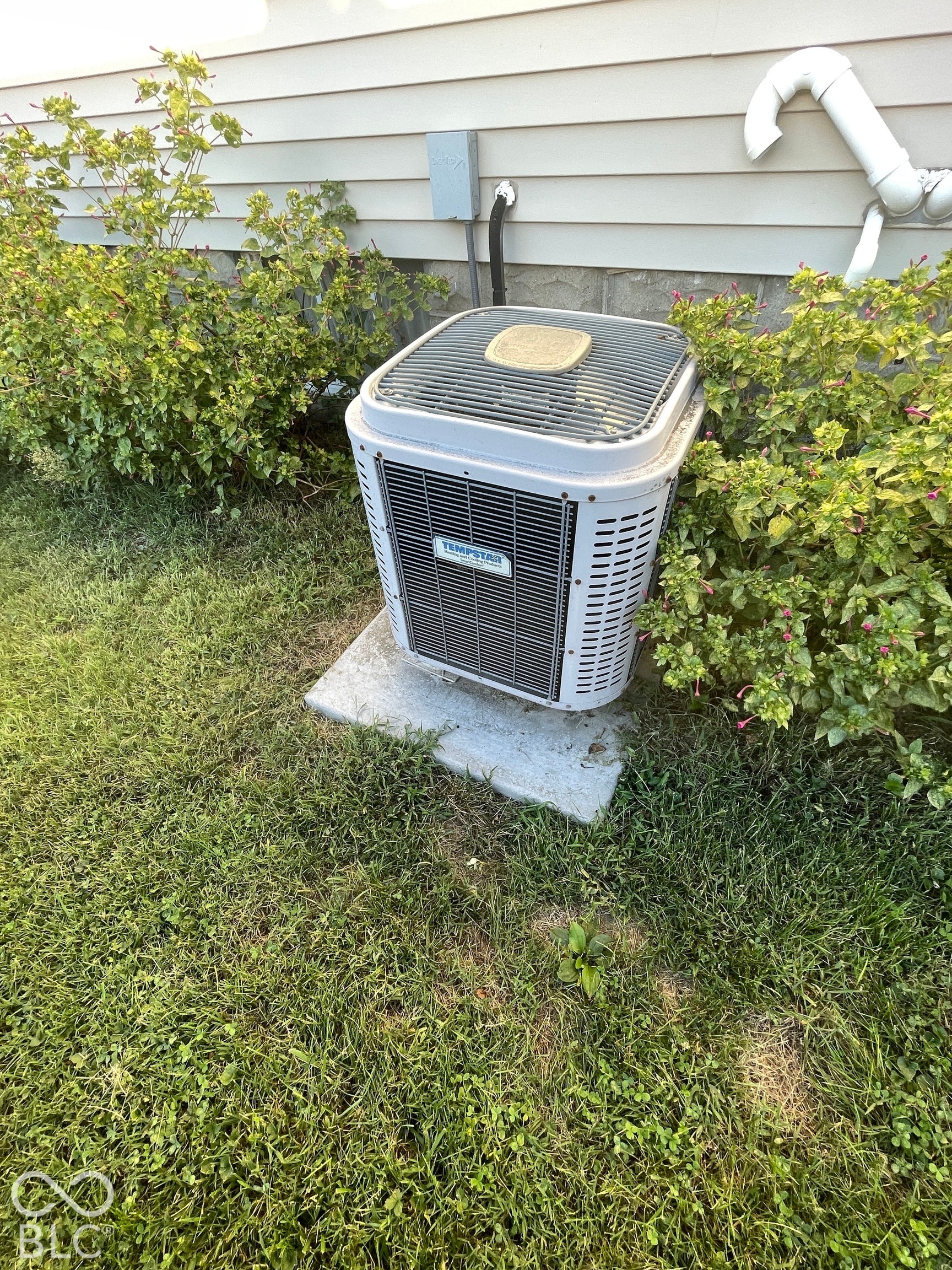 Exterior air conditioning unit on a concrete pad