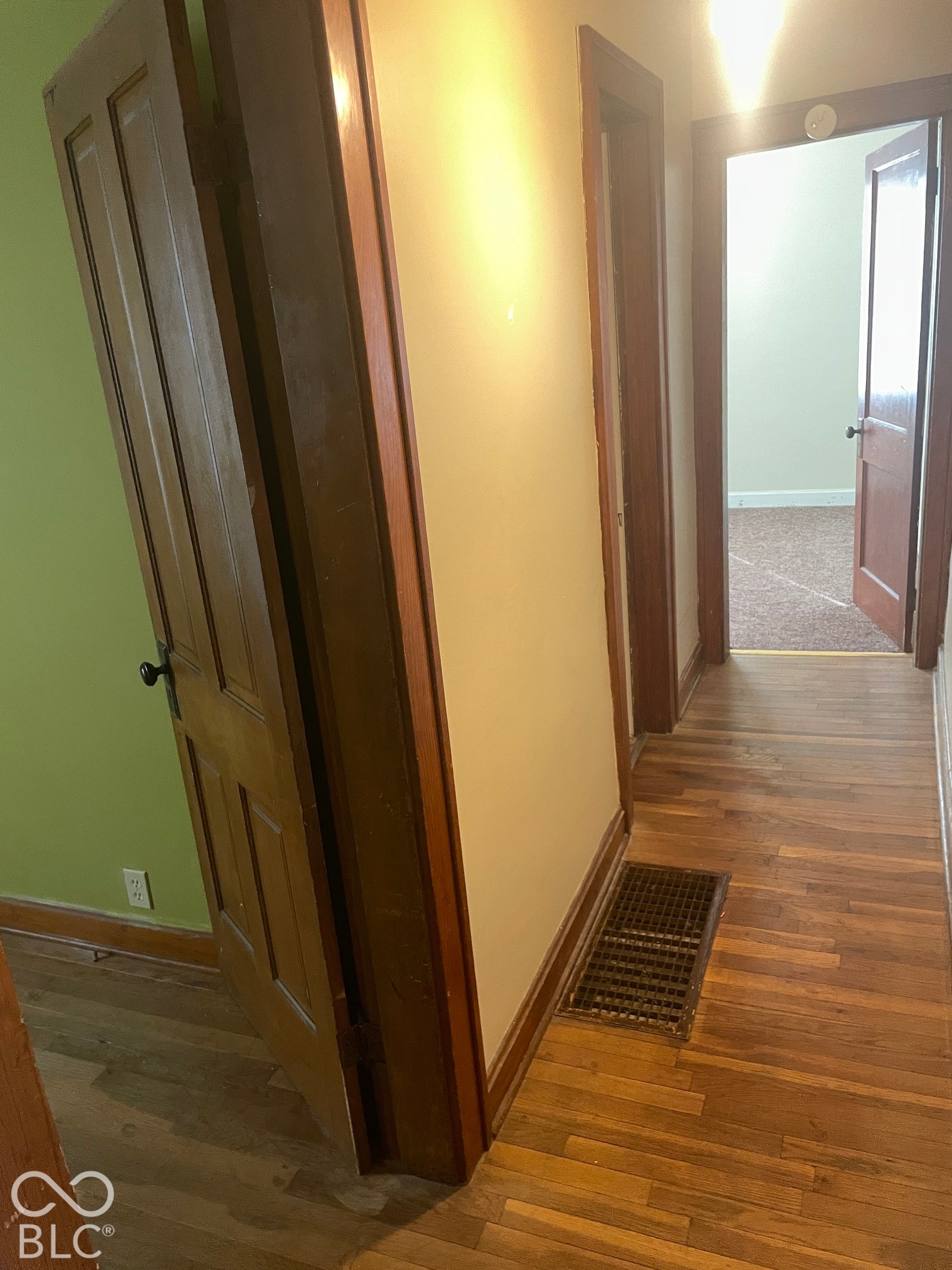 Wood-finish flooring with dark wood trim throughout