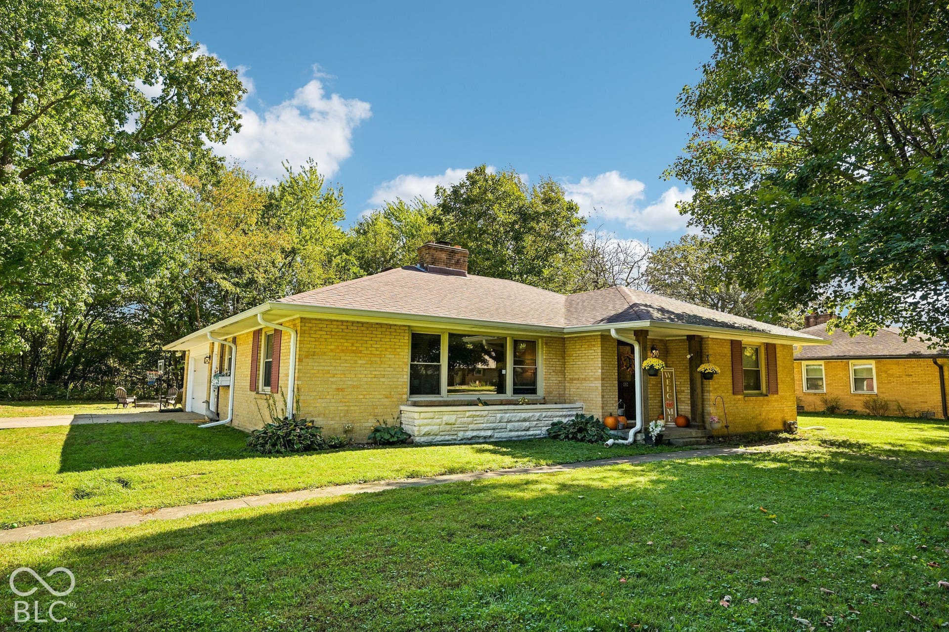 Brick exterior with a gabled roof and covered front entry