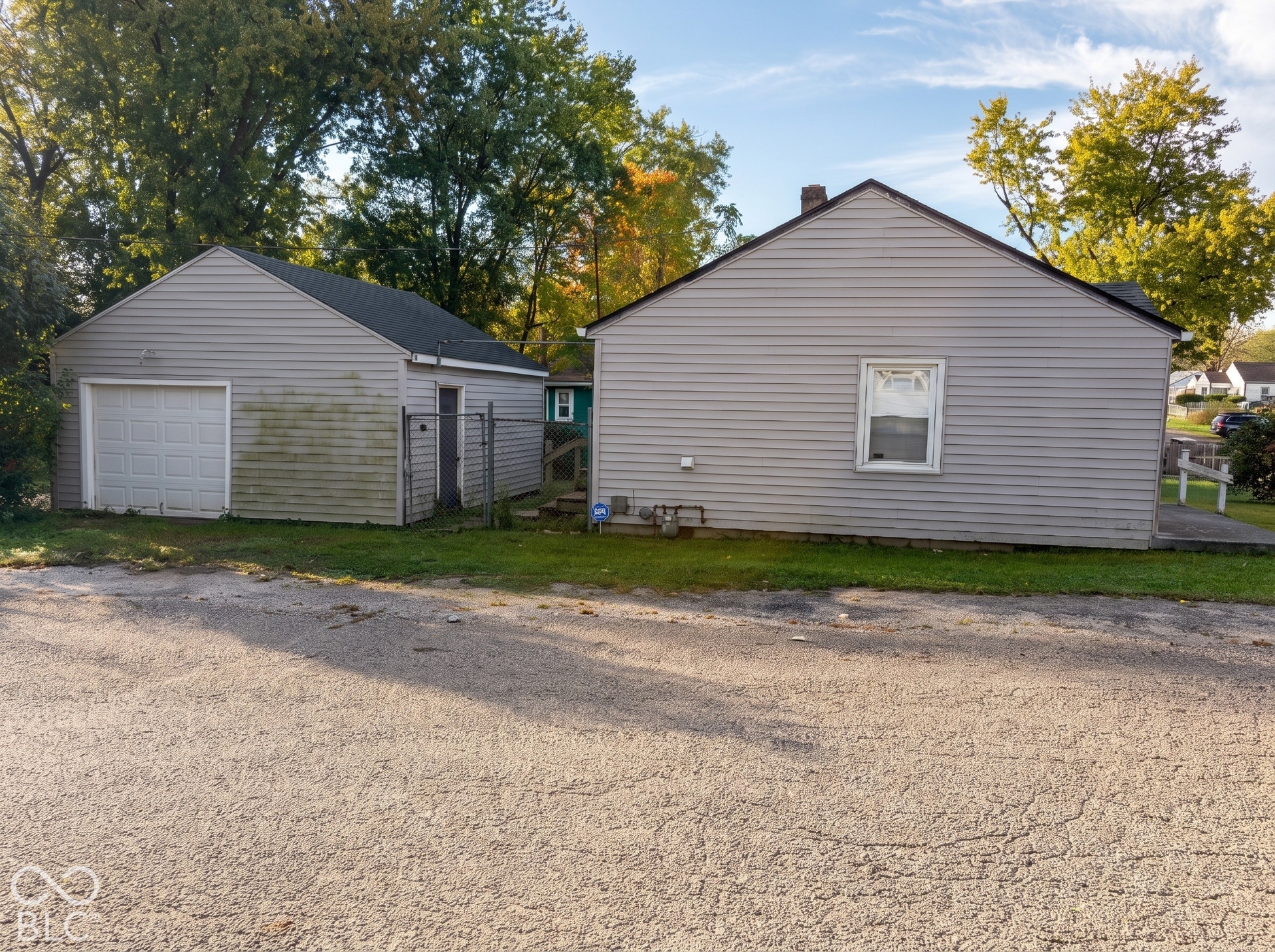 Detached garage with white overhead door