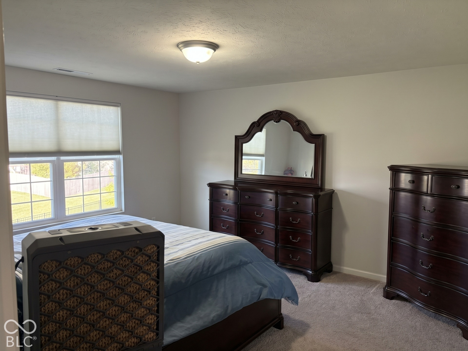 Virtually Altered - Primary bedroom with carpeted flooring, neutral wall paint, and overhead flush mount lighting