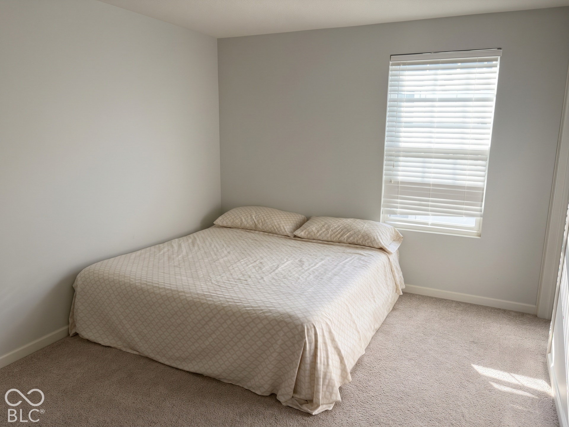 Virtually Altered - Bedroom 3 with neutral wall paint, window with blinds, and carpeted flooring