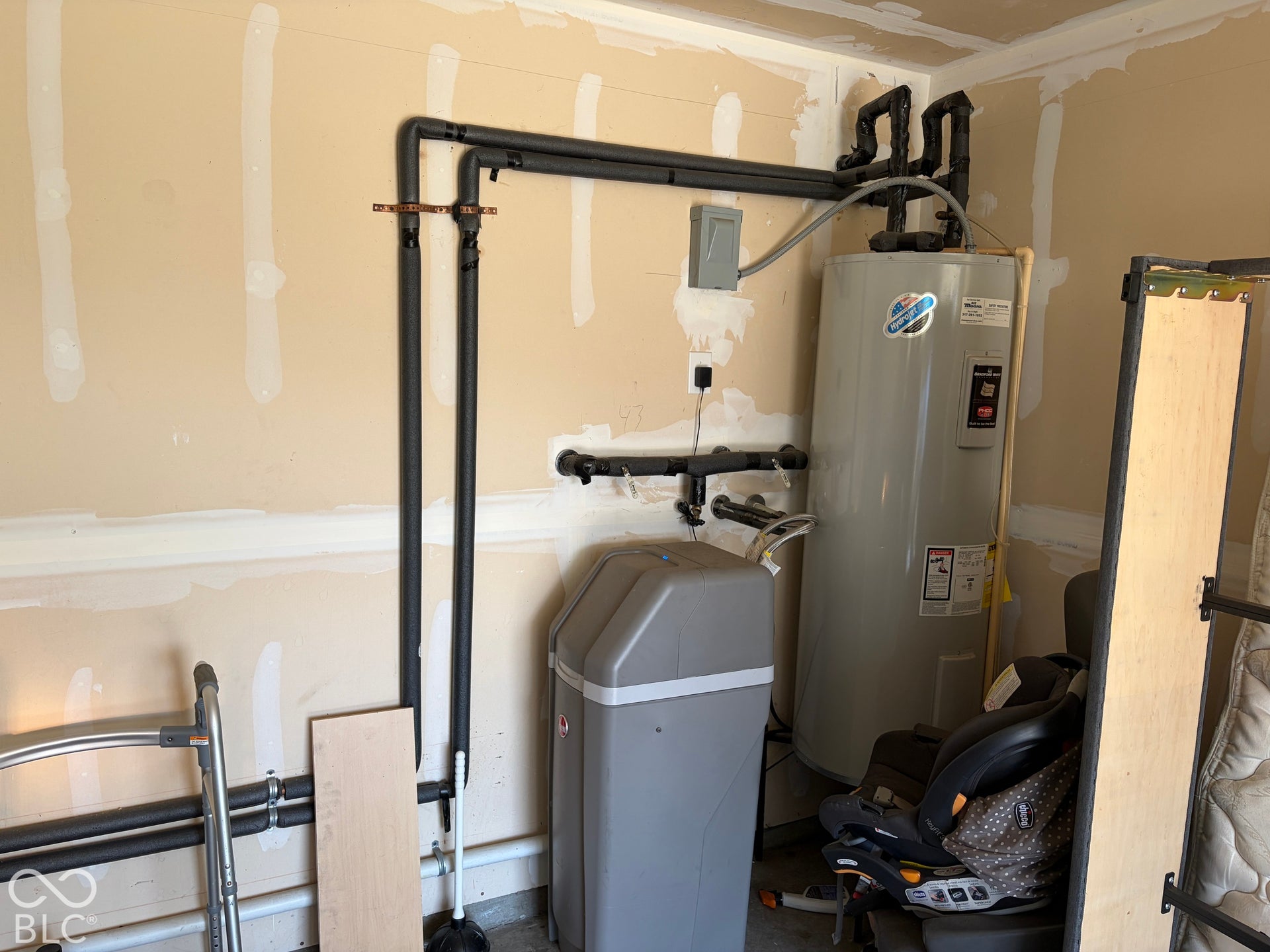 Virtually Altered - Garage utilities with water softener system and water heater