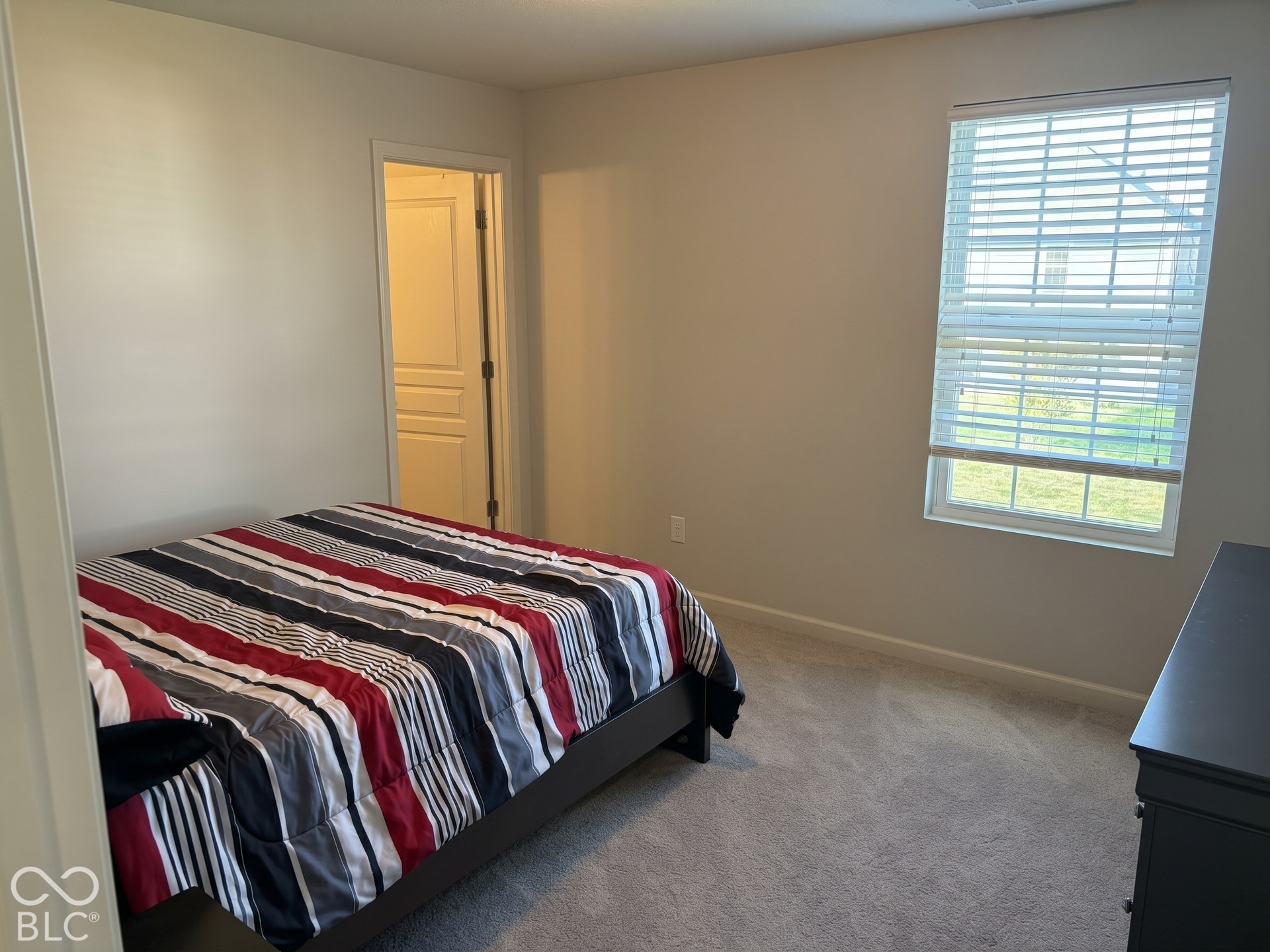 Virtually Altered - Bedroom 4 with neutral wall paint, window with blinds, and carpeted flooring
