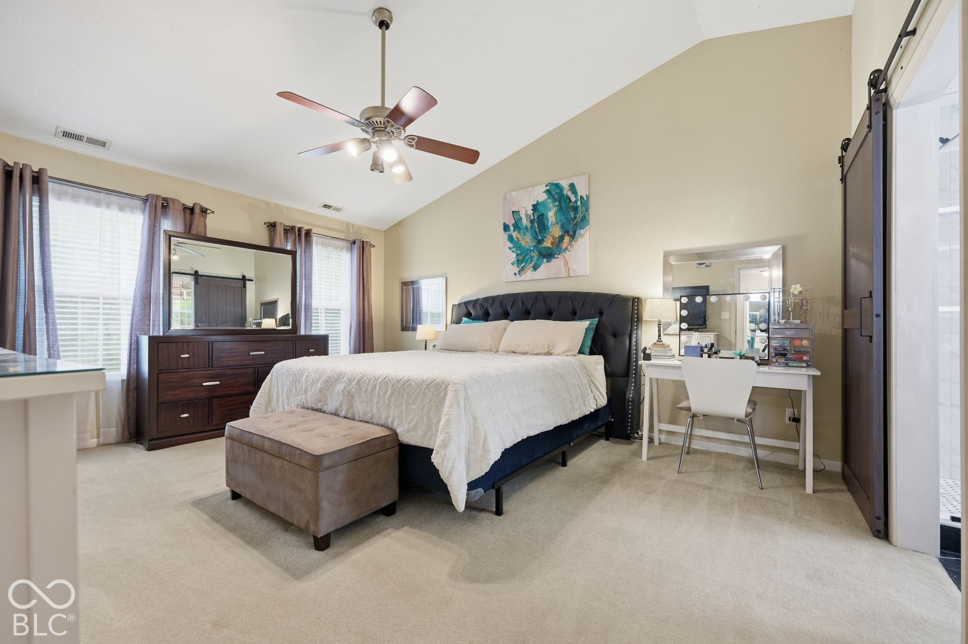 Large Primary Bedroom Features A Vaulted Ceiling
