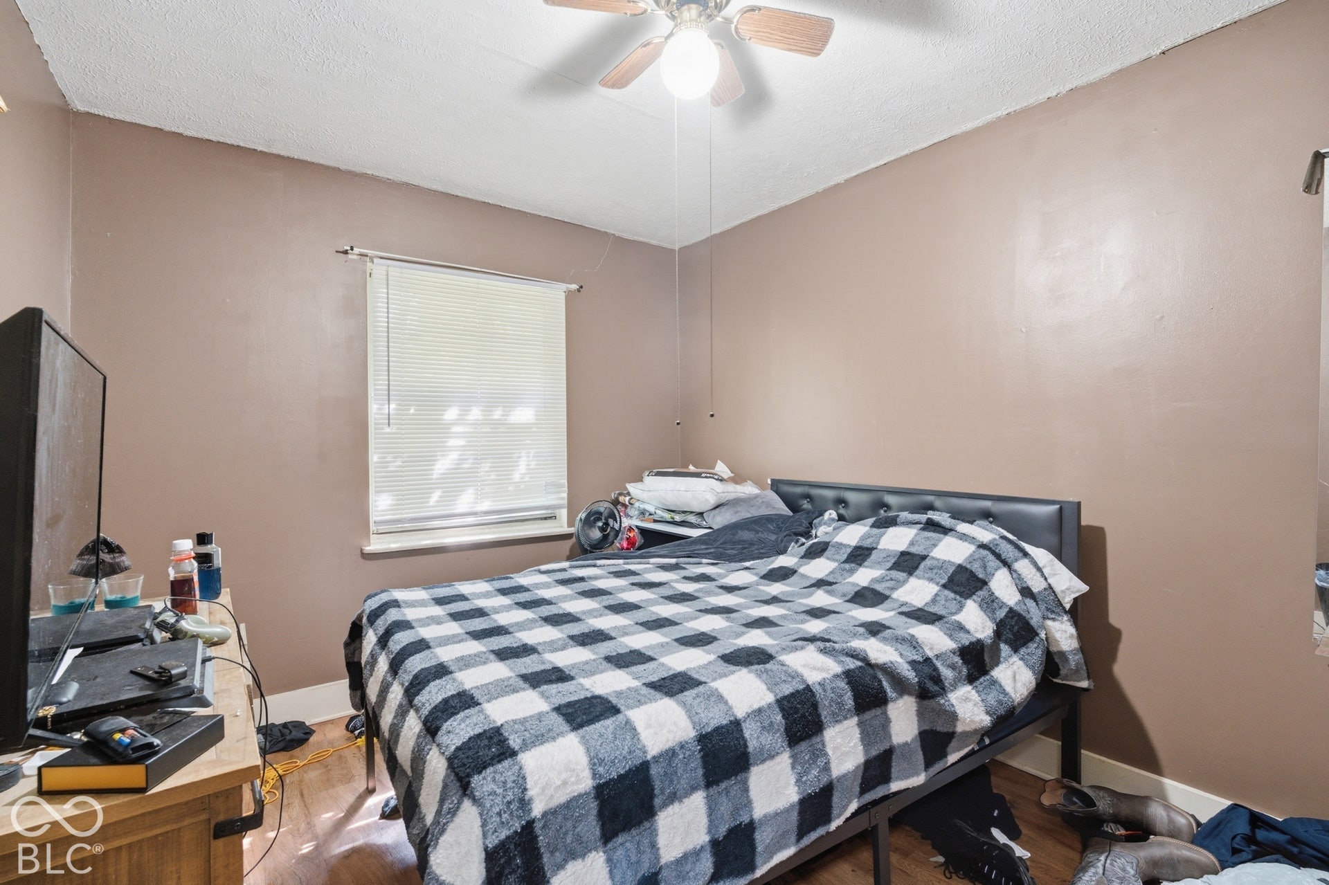 1273 Farley, Indianapolis, IN 46214 Wood-finish flooring with a ceiling fan and window