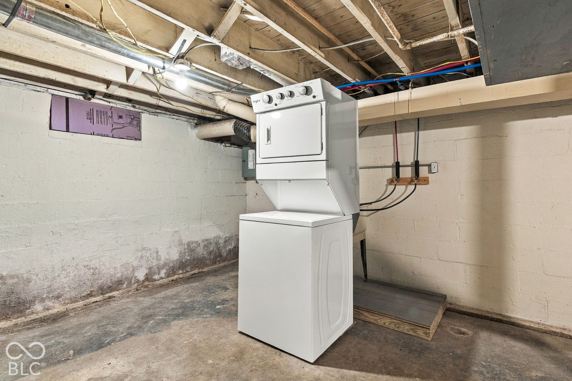 1910: Laundry In Basement w/ Storage Area
