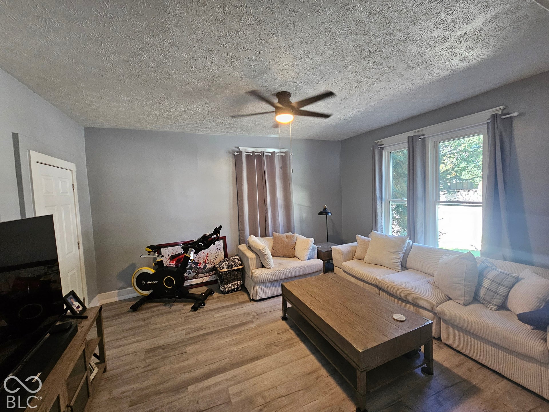 917 W 8th Street, Anderson, IN 46016 Recessed lighting, ceiling fan, wood-finish flooring, white trim, and multiple windows