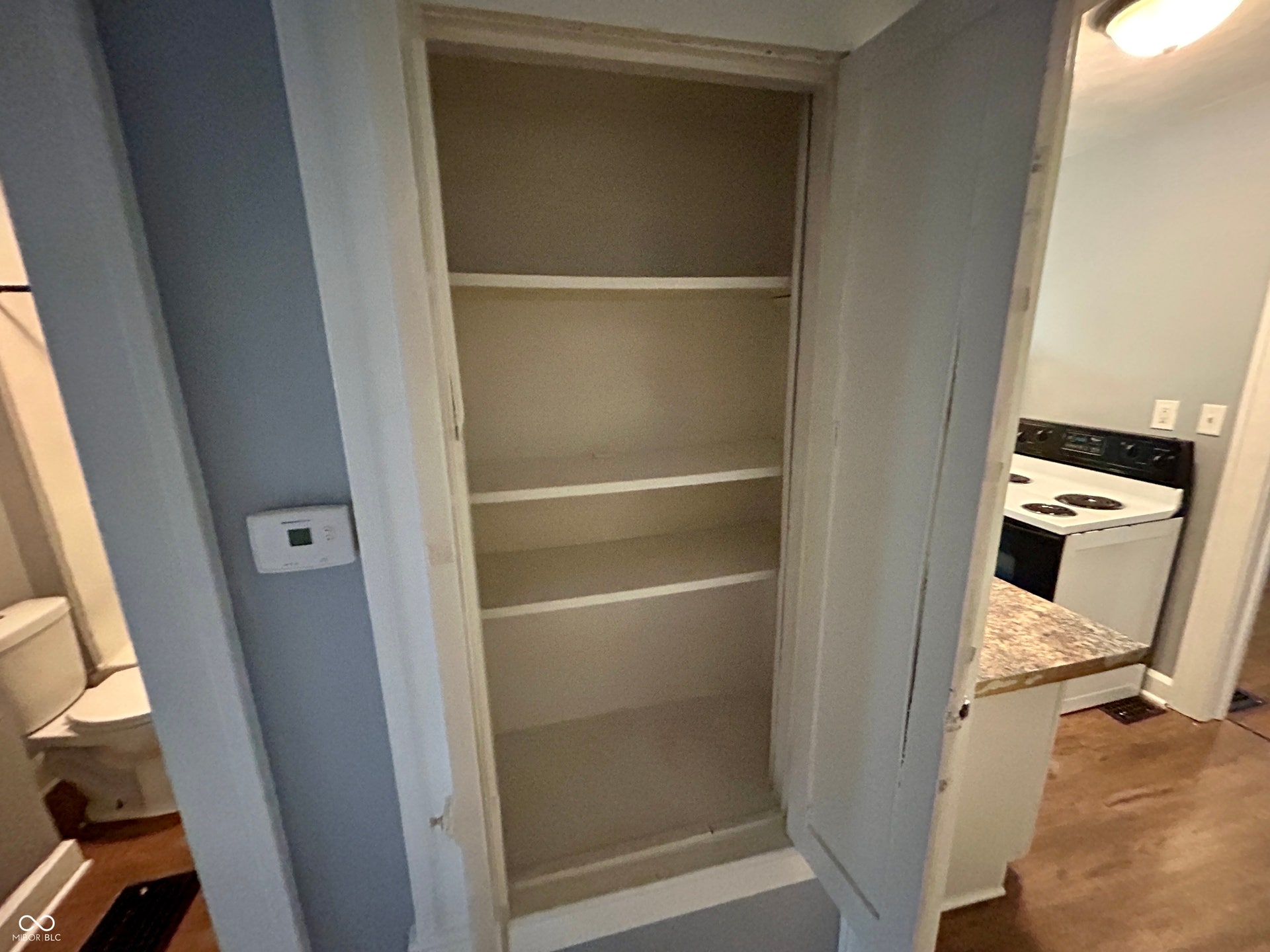 Built-in storage cabinet with multiple shelves