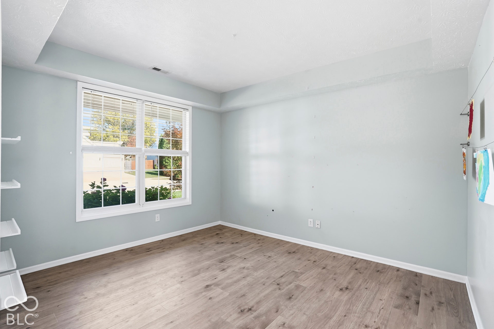 Wood-finish flooring with light-toned walls