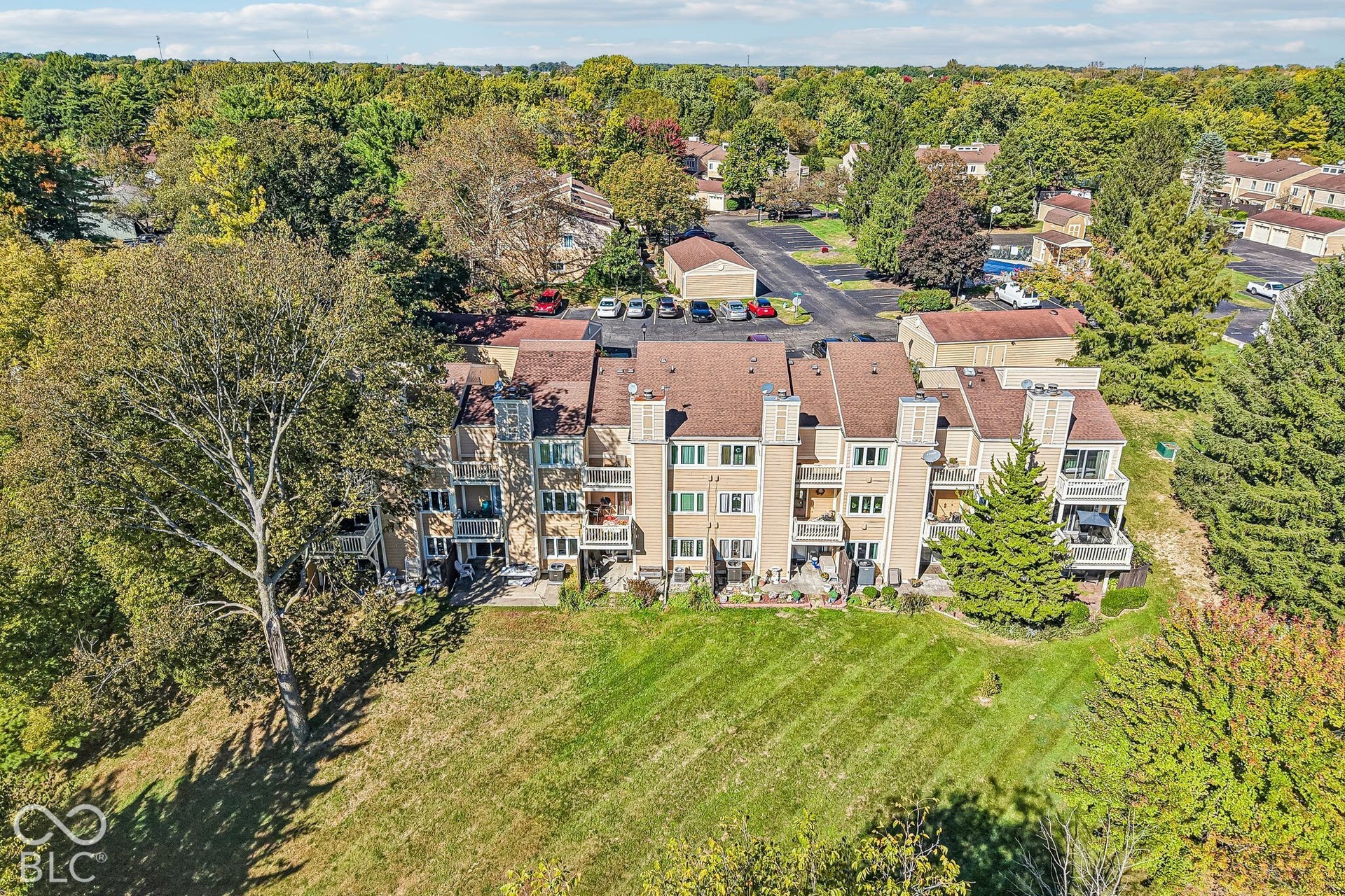 Multi-level residential building featuring private balconies and patios