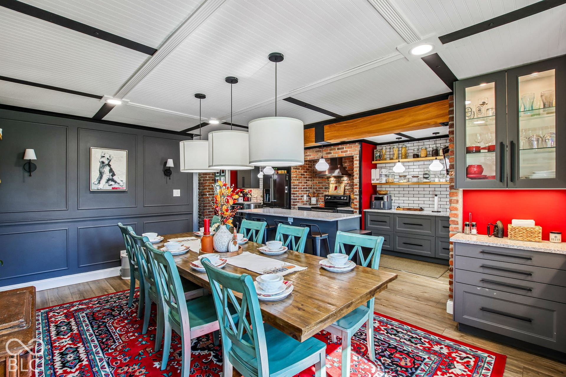 Dining area with wood-finish flooring, wainscoting, and a beadboard ceiling