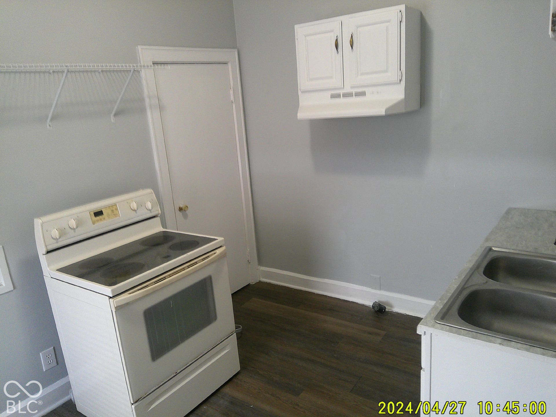 Wood-finish flooring with light gray wall paint