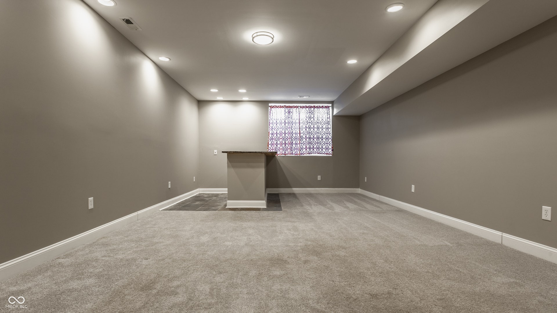 Large finished basement with wet bar.