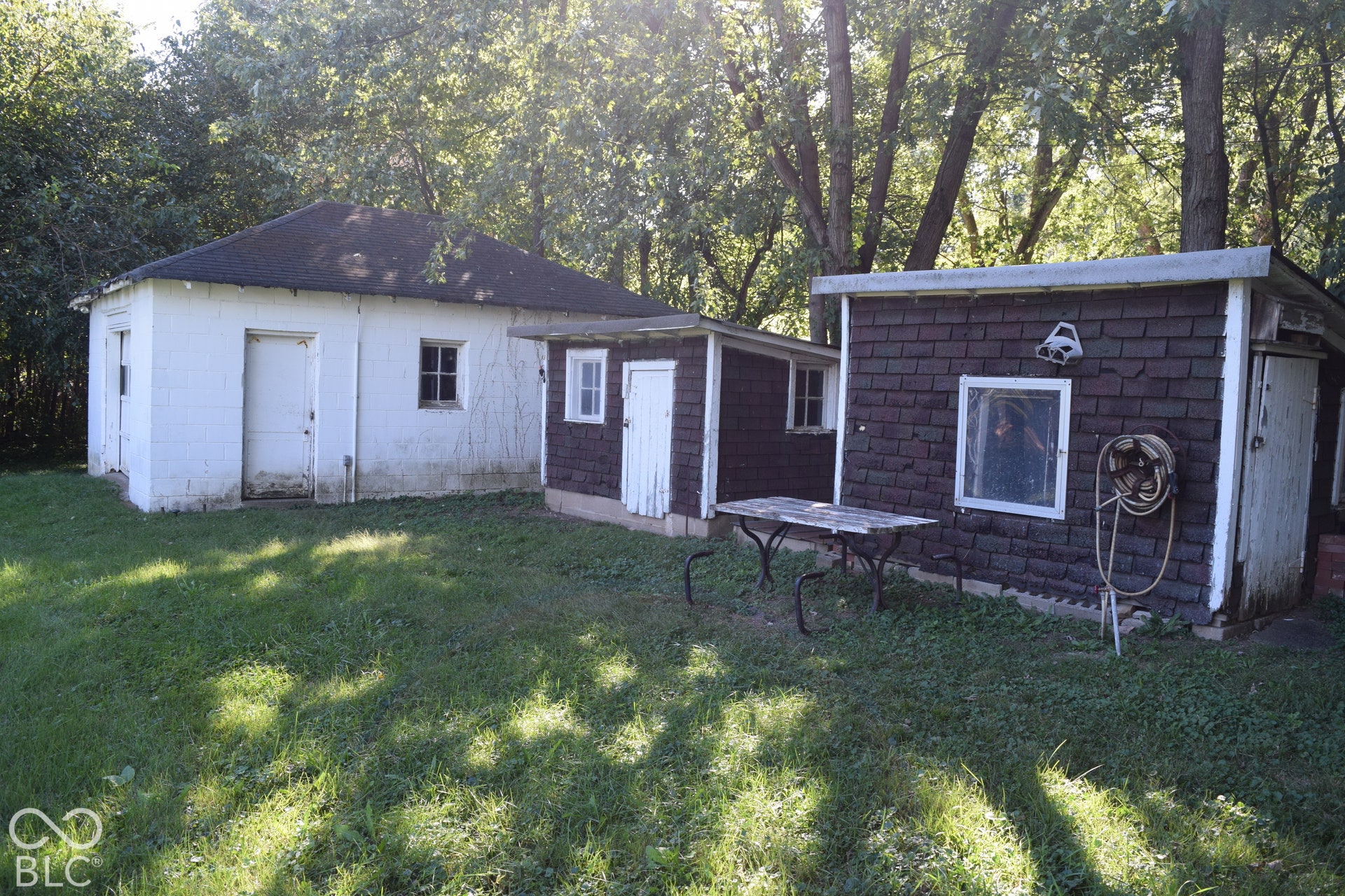 Detached garage with outbuildings.