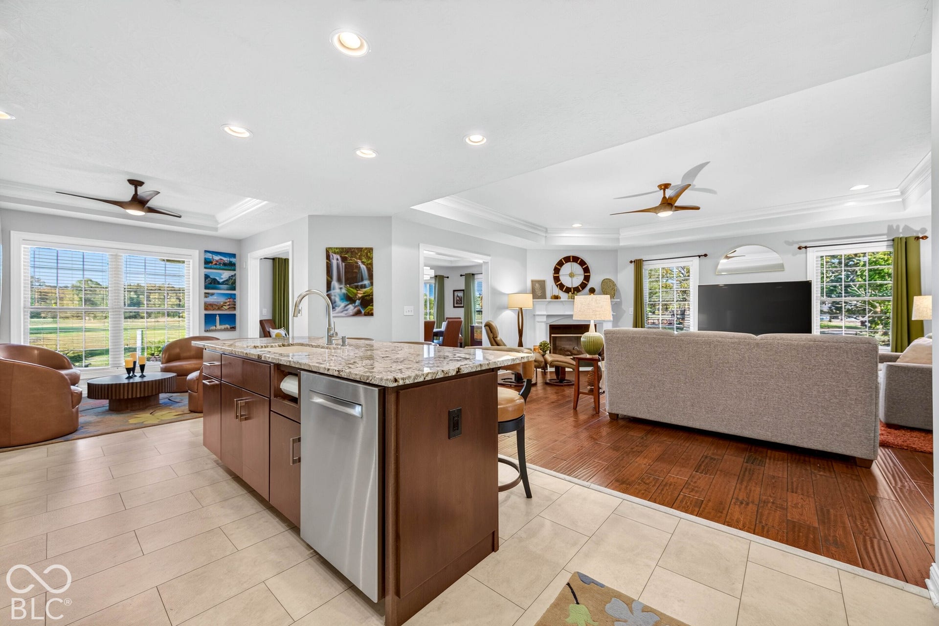 Kitchen island with granite countertop and integrated stainless steel dishwasher