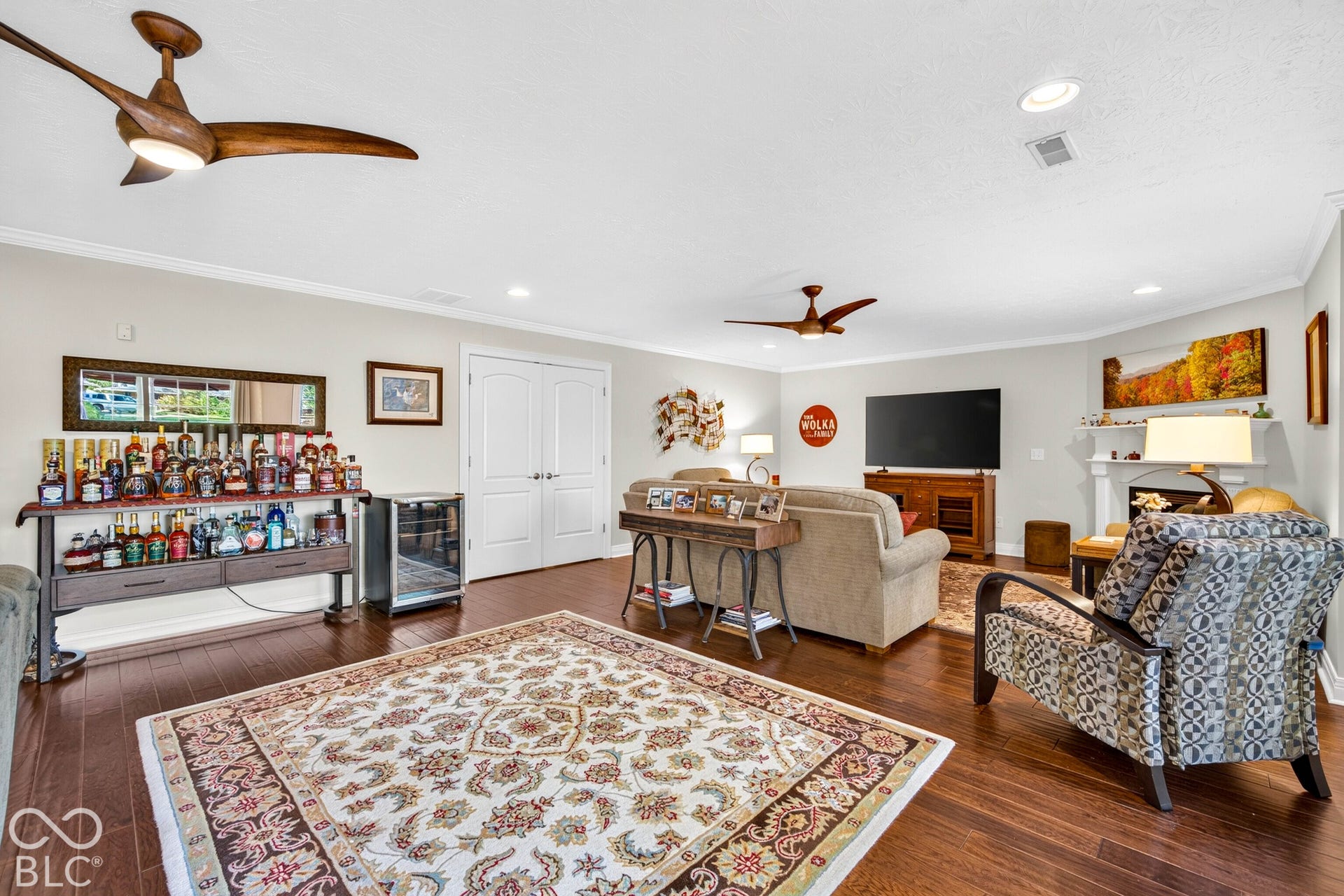 Hardwood-finish flooring throughout, recessed lighting, and crown molding
