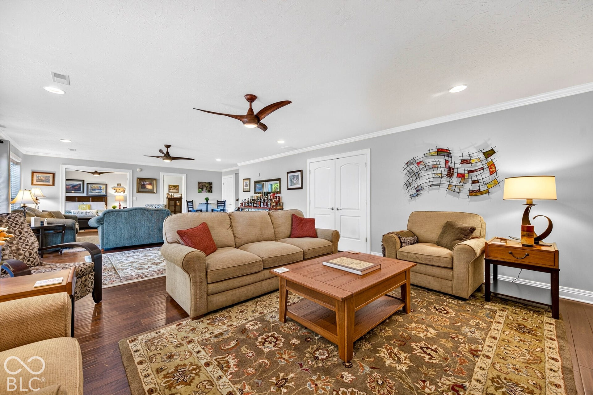 Recessed lighting, wood-finish flooring, and multiple ceiling fans