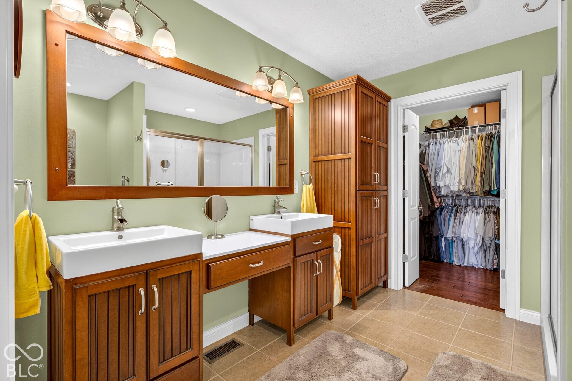 Dual vanity with vessel sinks and brushed nickel faucets