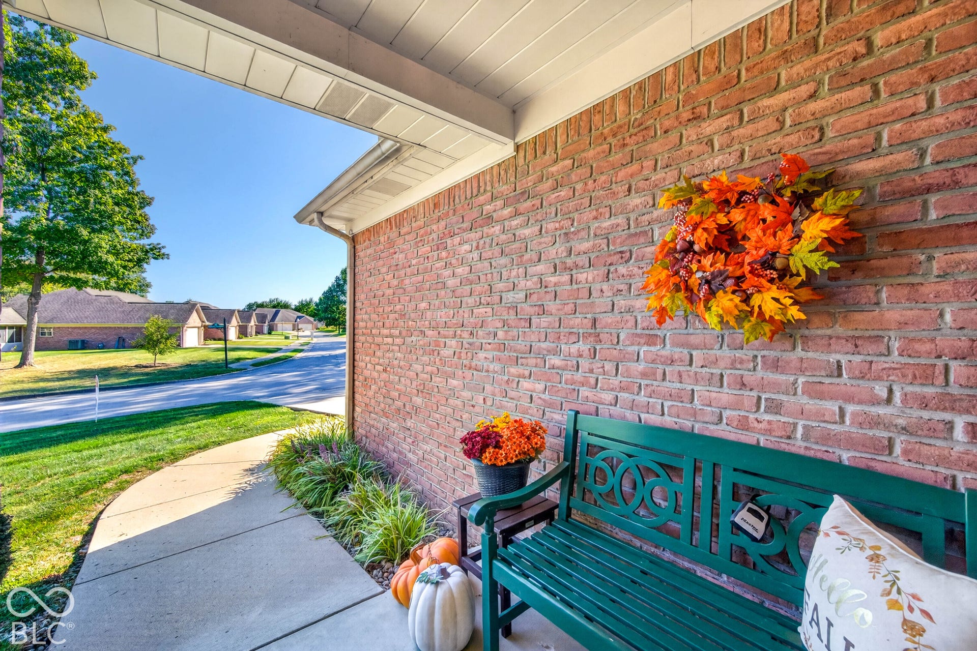 Brick facade with a covered porch entry