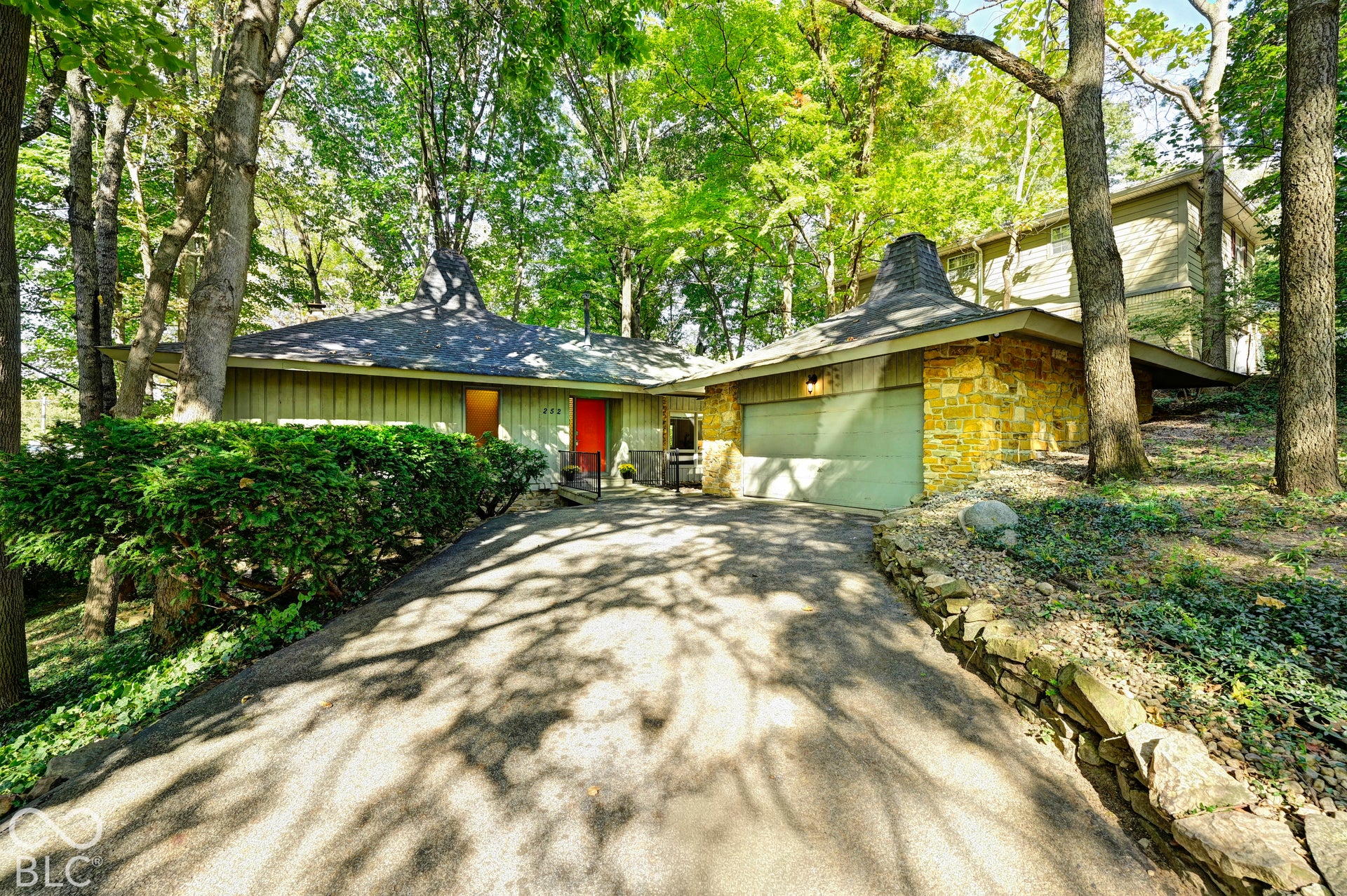 The Woods House at 252 W Beverly Dr: a 1967 midcentury modern designed by Indianapolis architect Clyde E. Woods for his own family, set into a private wooded ravine in north Butler-Tarkington. First time offered for sale in 59 years.