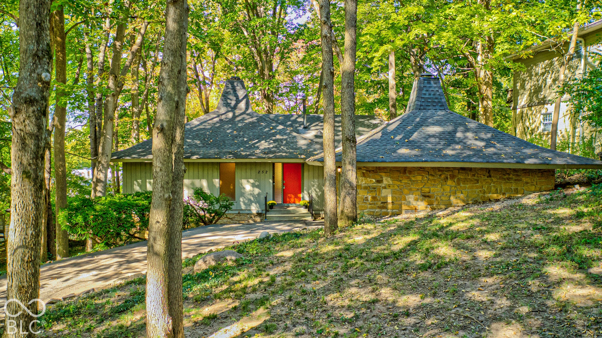 The conical roof peaks, inspired by Japanese architecture, have made this home a neighborhood landmark for decades. A true original among Indianapolis midcentury modern homes.