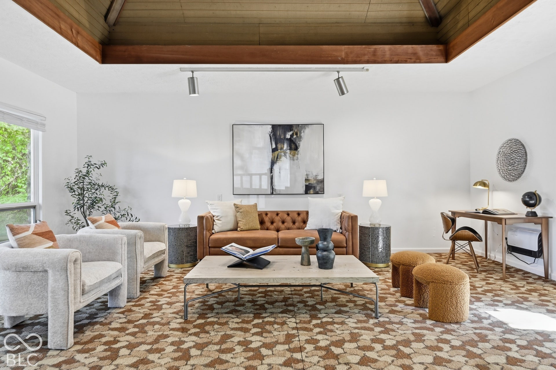 Family room with its geometric patterned floor and wood ceiling. The Woods family simply called it "the room": birthday parties, records playing and decades of memories happened here.