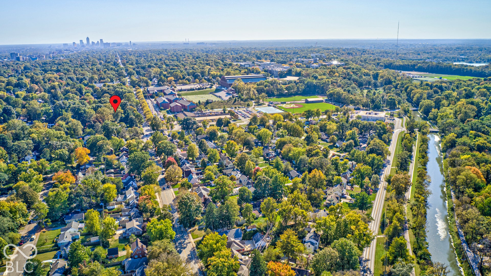 Home marked in red: close to the Central Canal Towpath, Butler University and the downtown skyline, with the seclusion of a wooded ravine lot.
