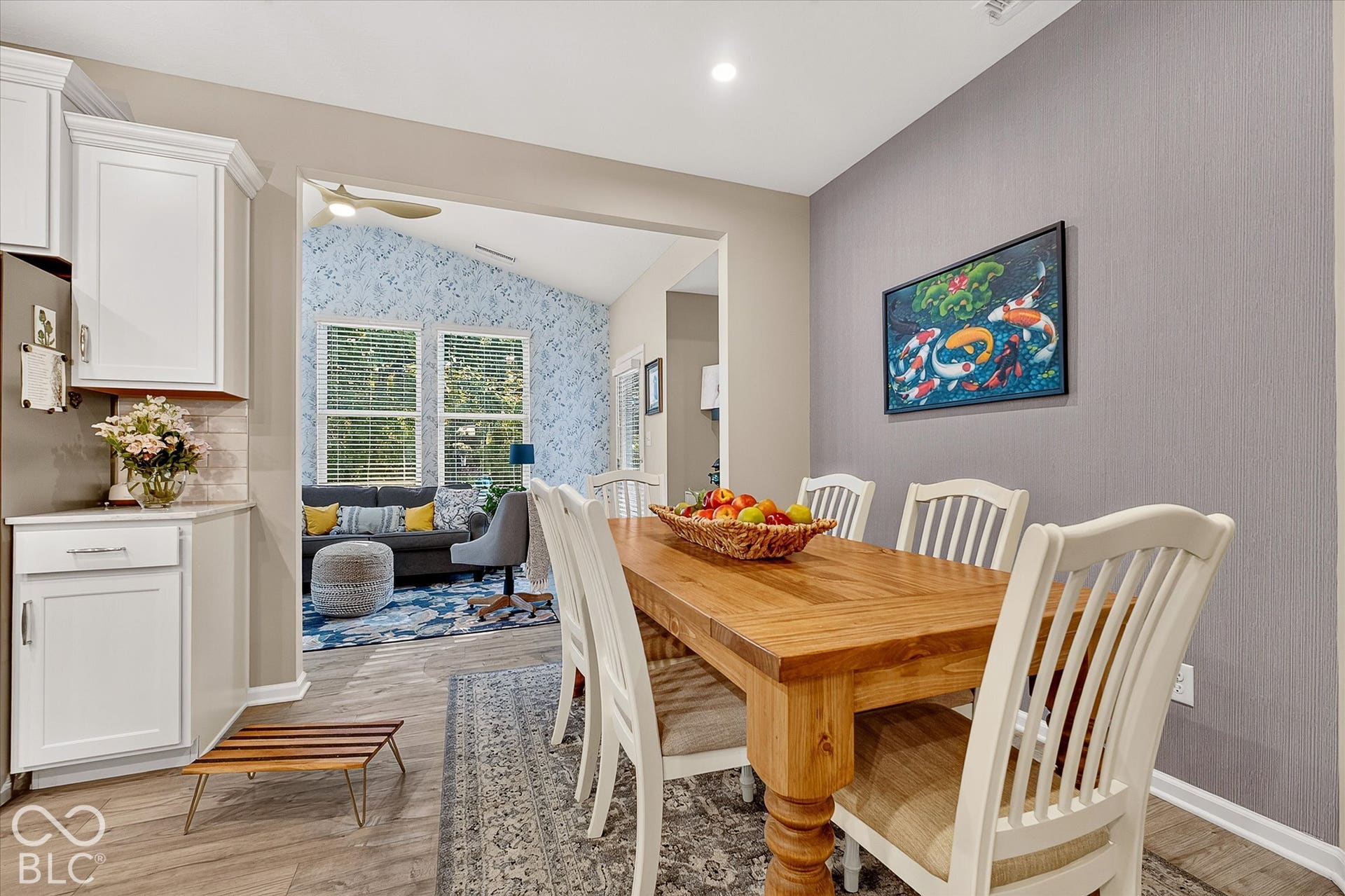 Dining area leads to the sun room.