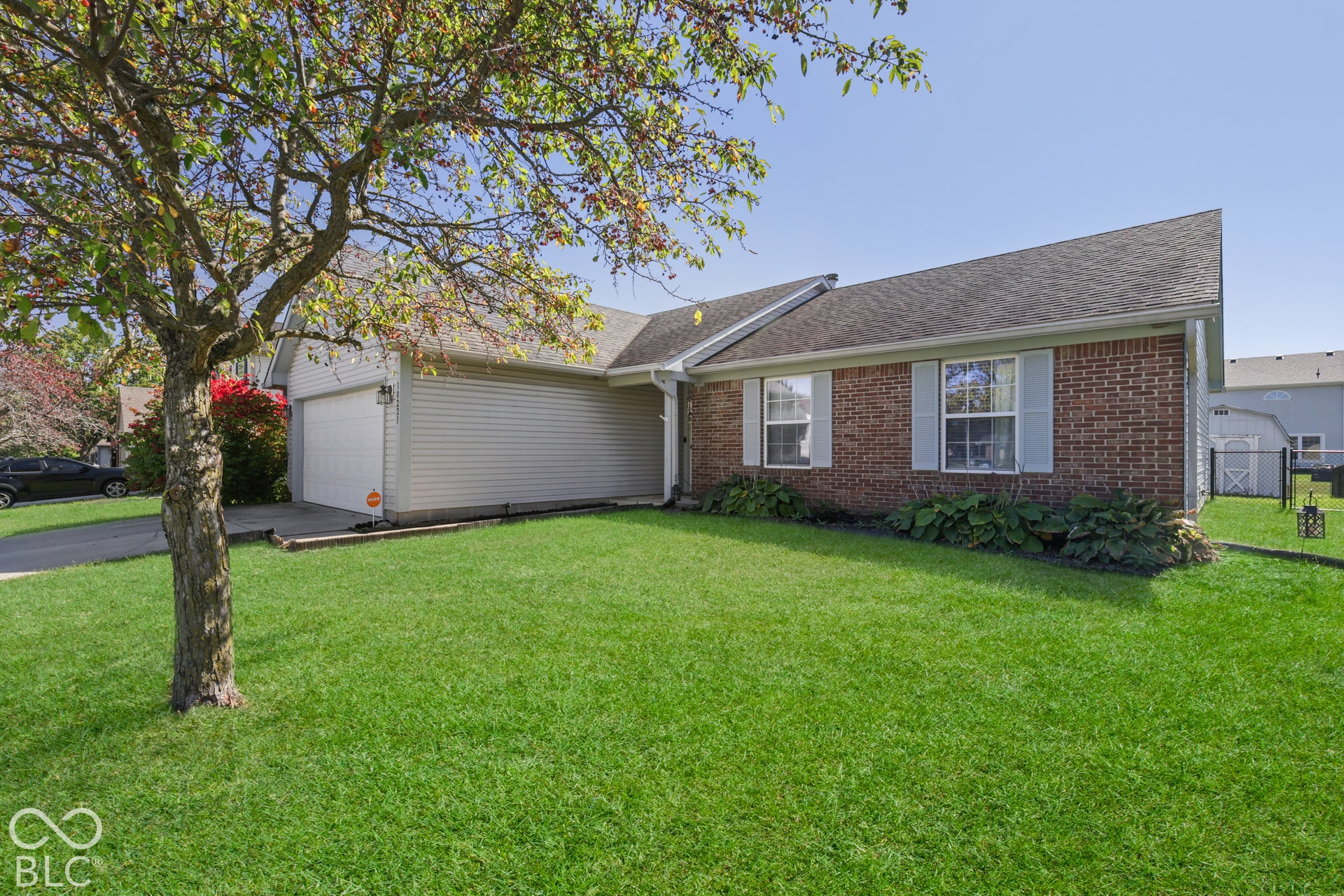 Brick and siding exterior with a single-car garage