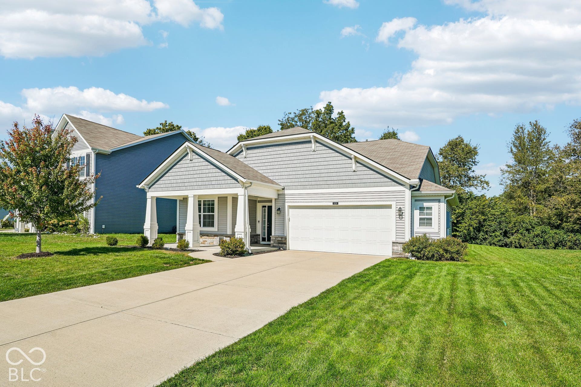 Exterior with gray siding and decorative shake accents