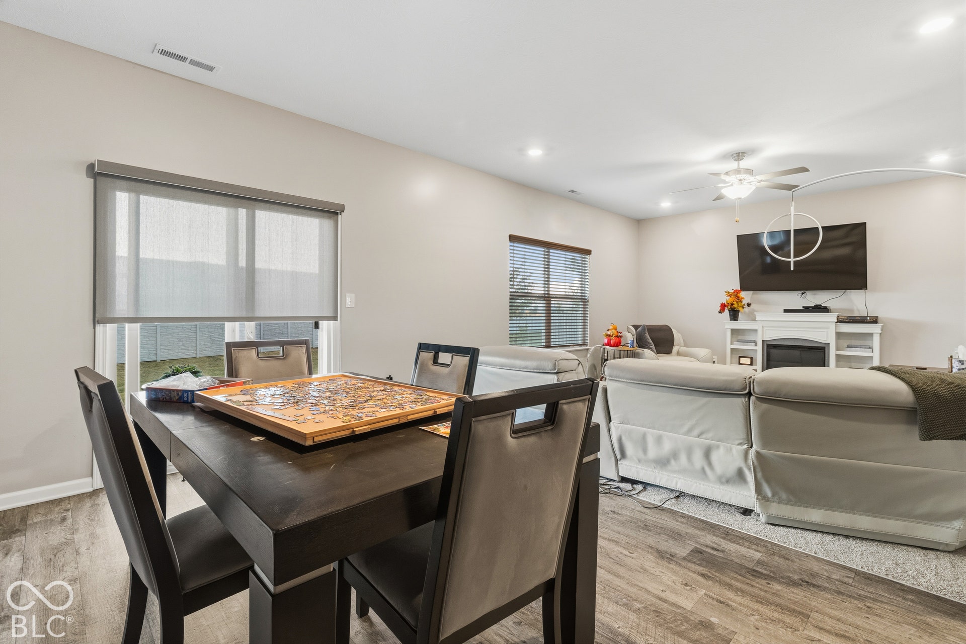 Wood-finish flooring throughout, recessed lighting, and a ceiling fan