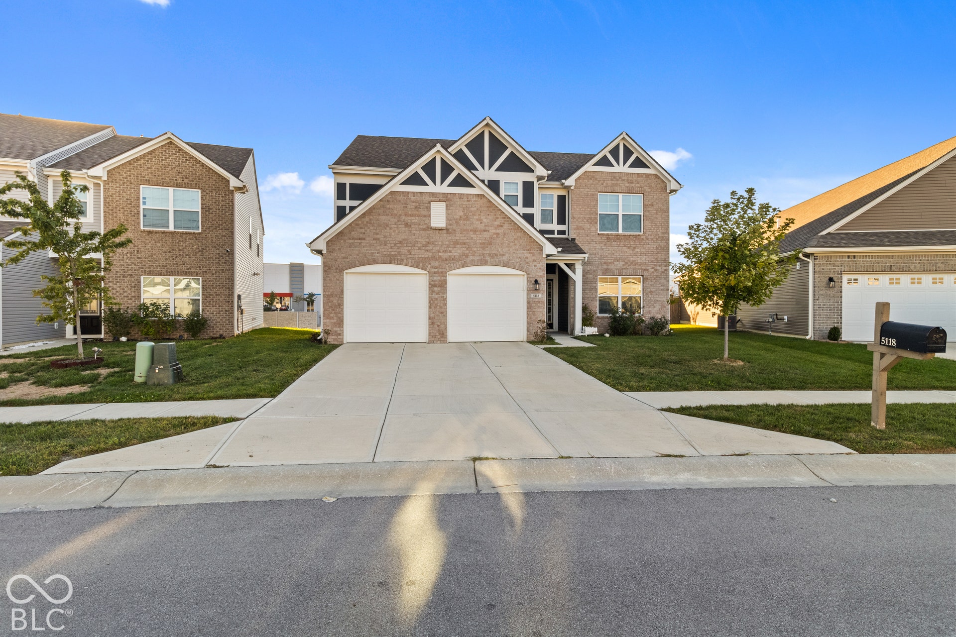 Brick and siding exterior with decorative gables