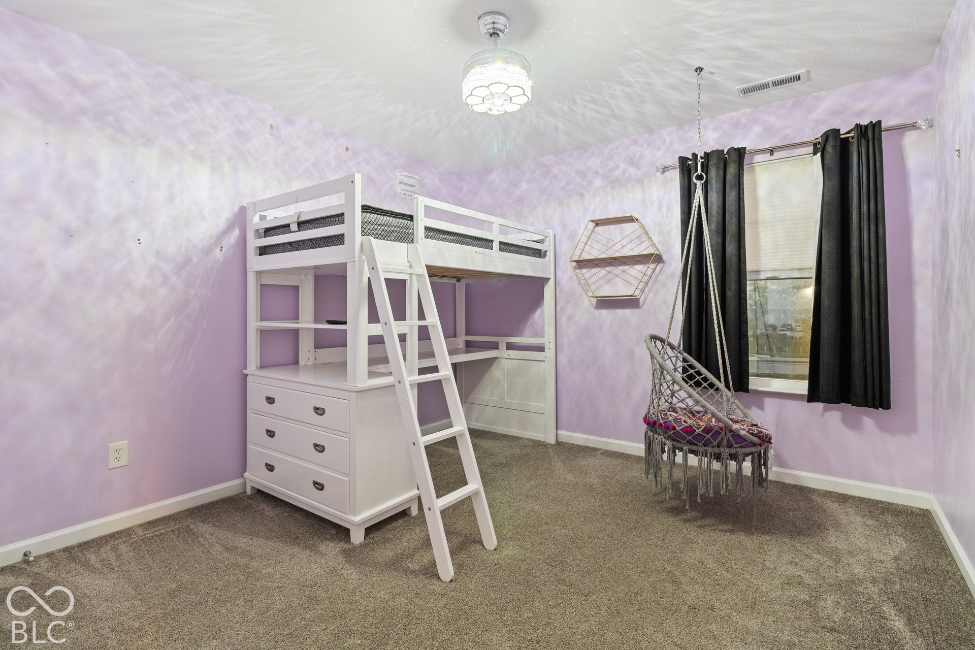 Carpeted flooring, window with dark drapes, white trim, and a ceiling light fixture