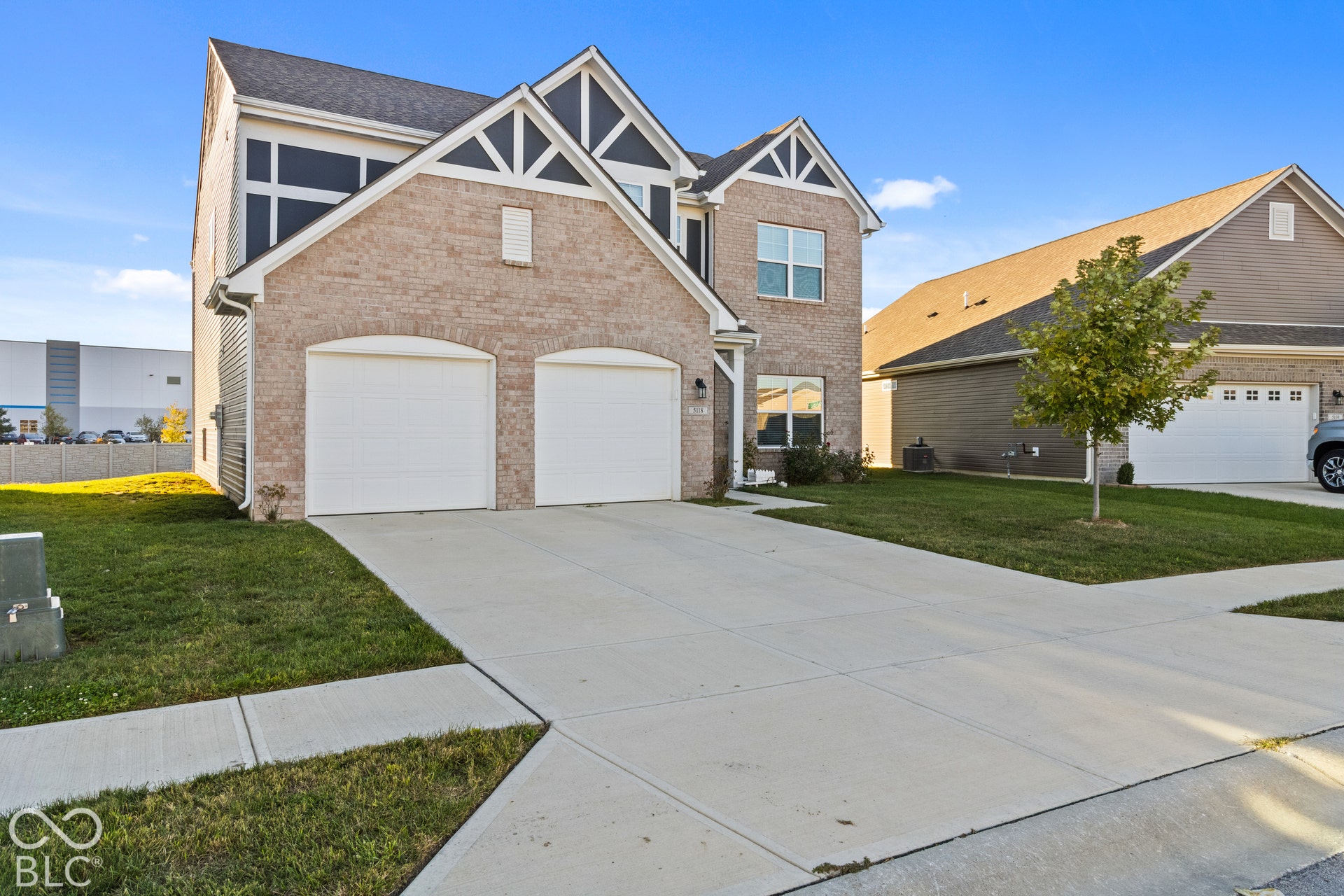 Brick and siding exterior with decorative gables