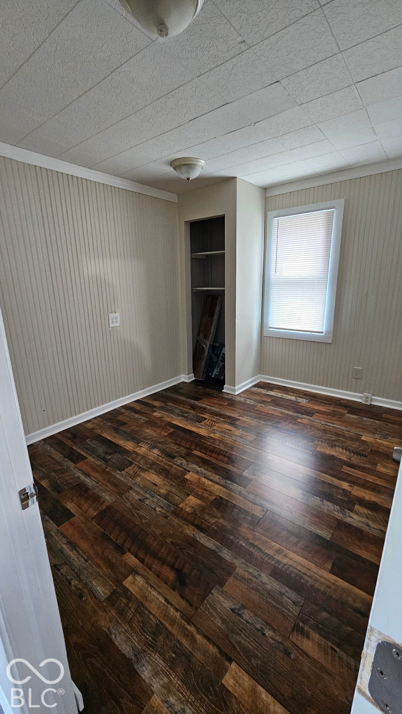 104 E State Street, New Ross, IN 47968 Wood-finish flooring, built-in shelving, and a window with blinds