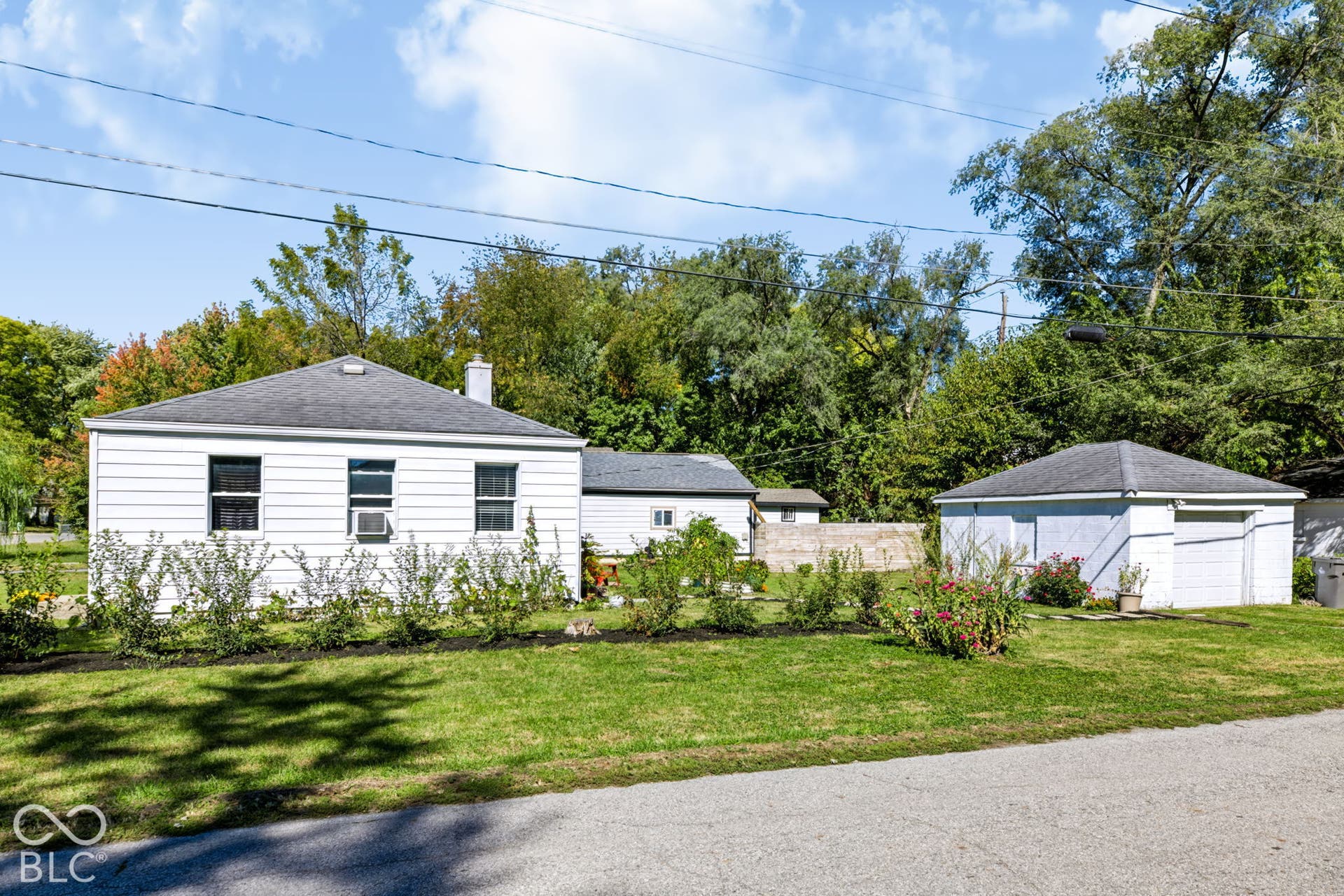 2101 Sharon Avenue, Indianapolis, IN 46222 White siding exterior with a dark shingle roof