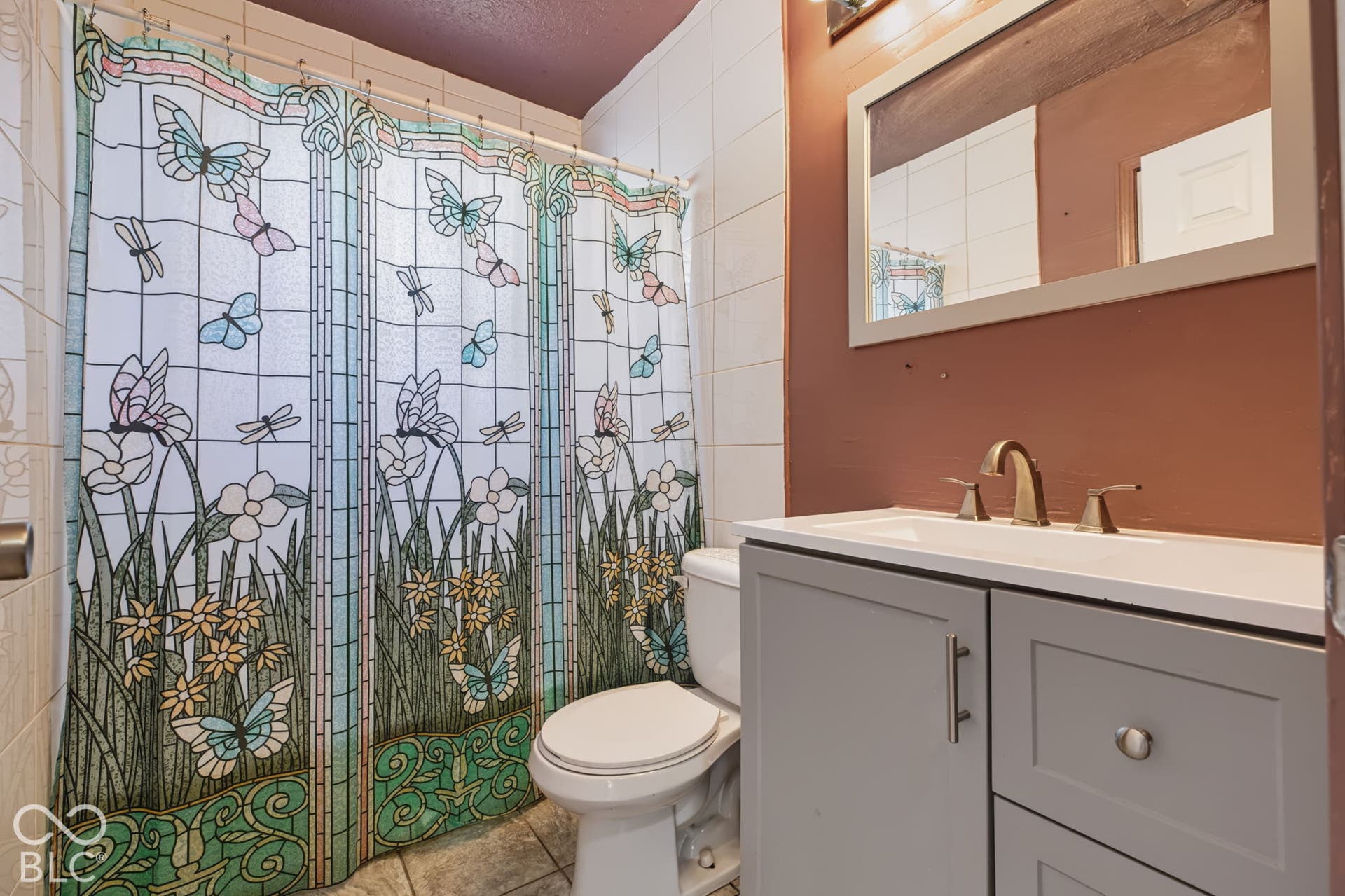 2101 Sharon Avenue, Indianapolis, IN 46222 Vanity with shaker-style cabinetry, an integrated sink, and a bronze-finish faucet