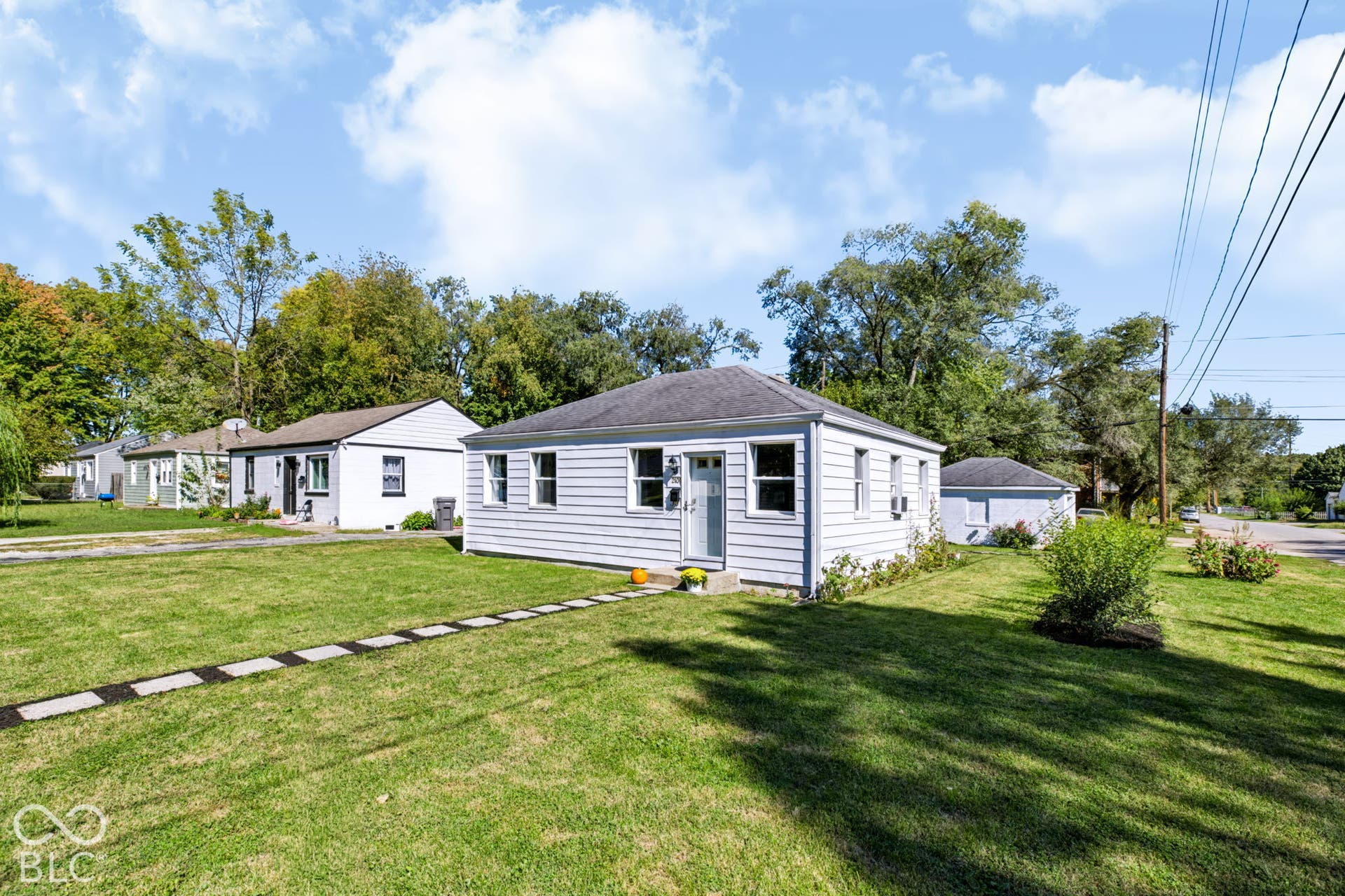 2101 Sharon Avenue, Indianapolis, IN 46222 White horizontal siding exterior with a dark shingle roof