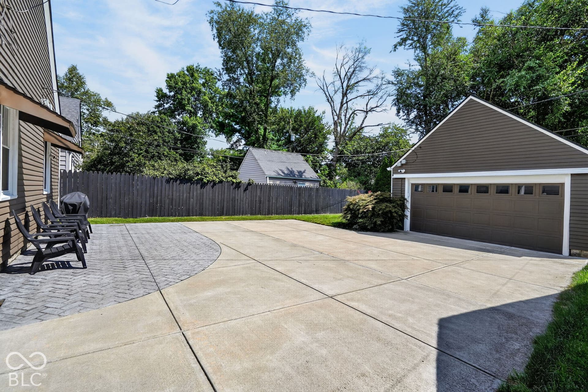 Large 2 car garage with new concrete driveway.