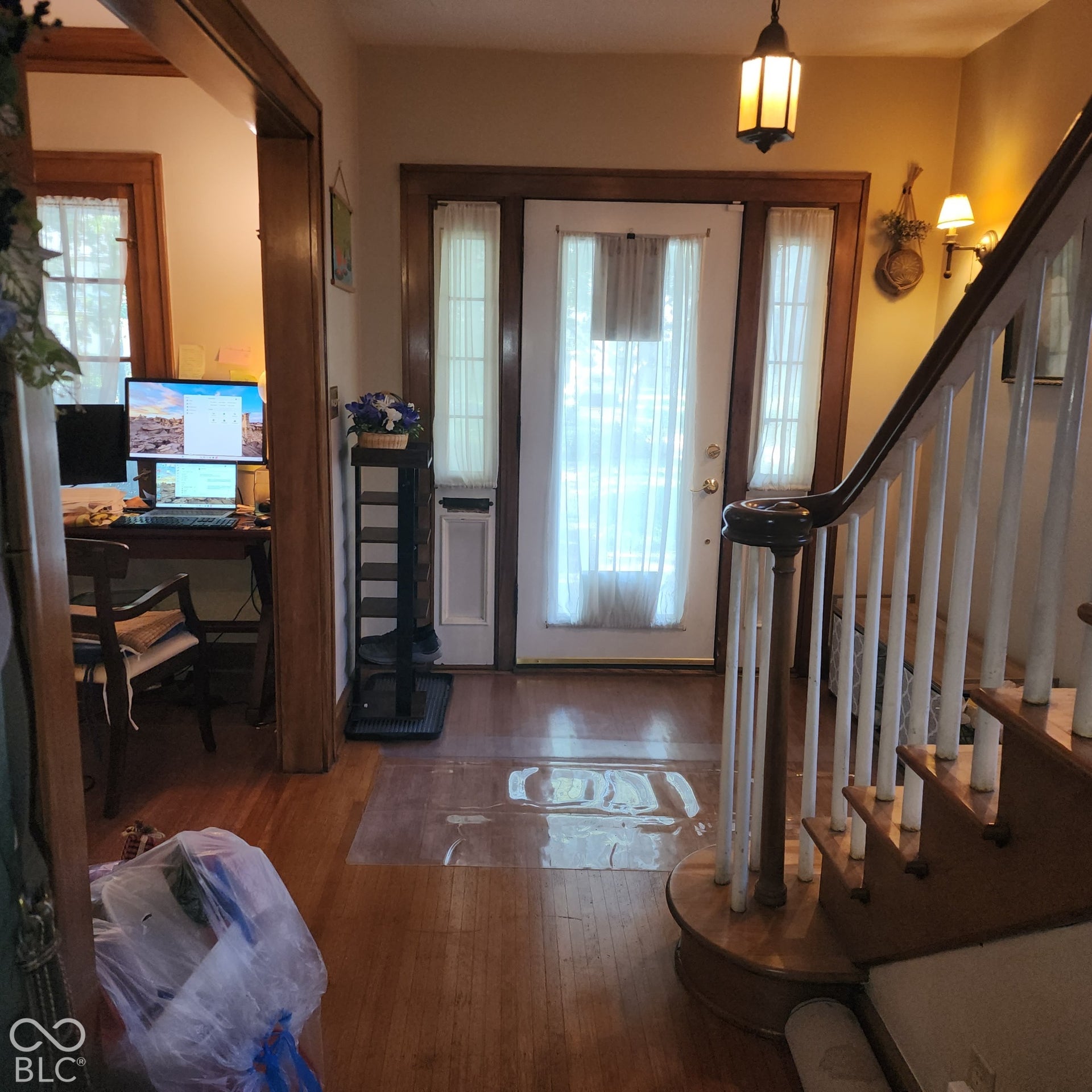 Wood-finish flooring throughout the entry