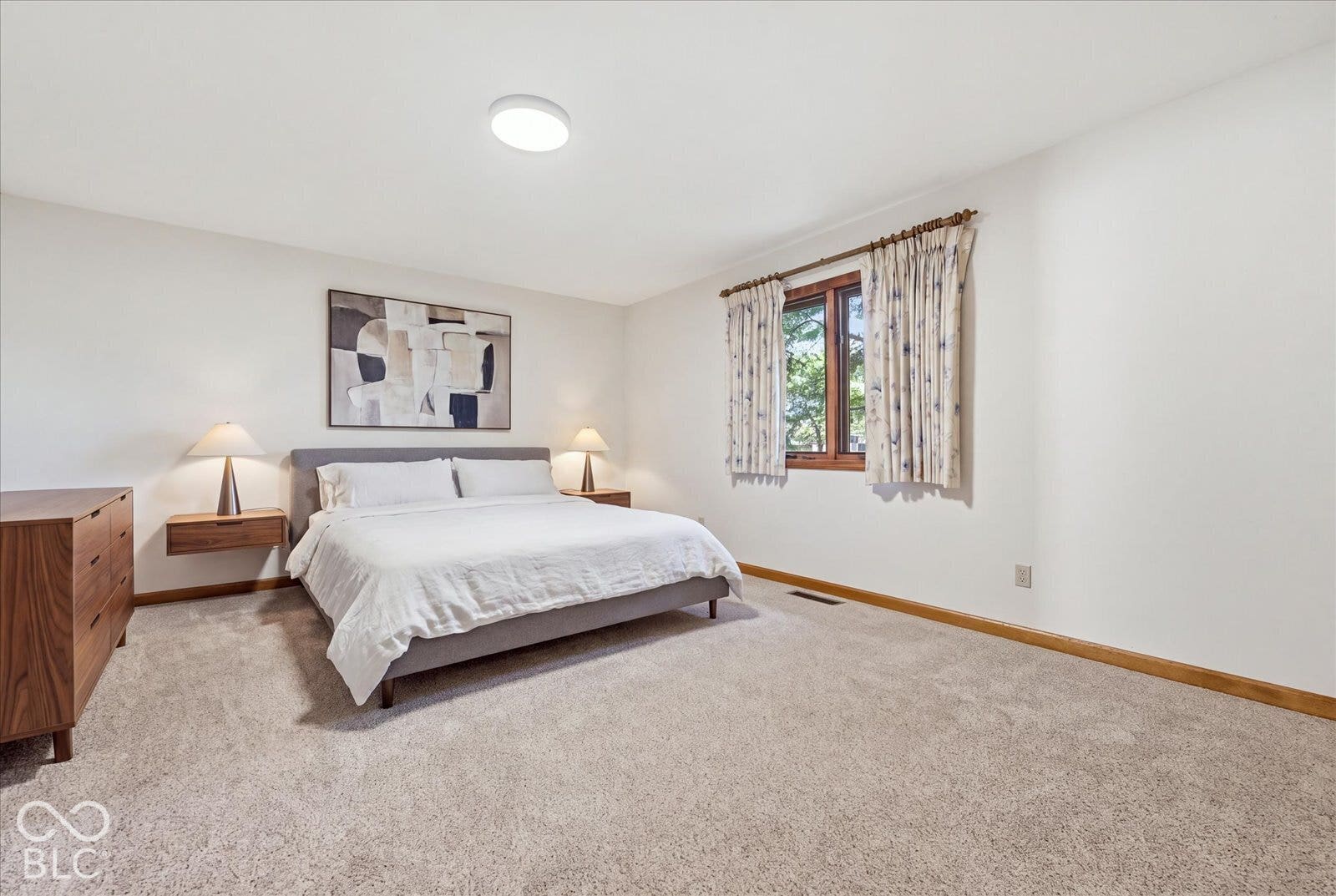 Virtually Altered - Neutral interior space featuring wall-to-wall carpeting, wood trim, and a recessed ceiling light