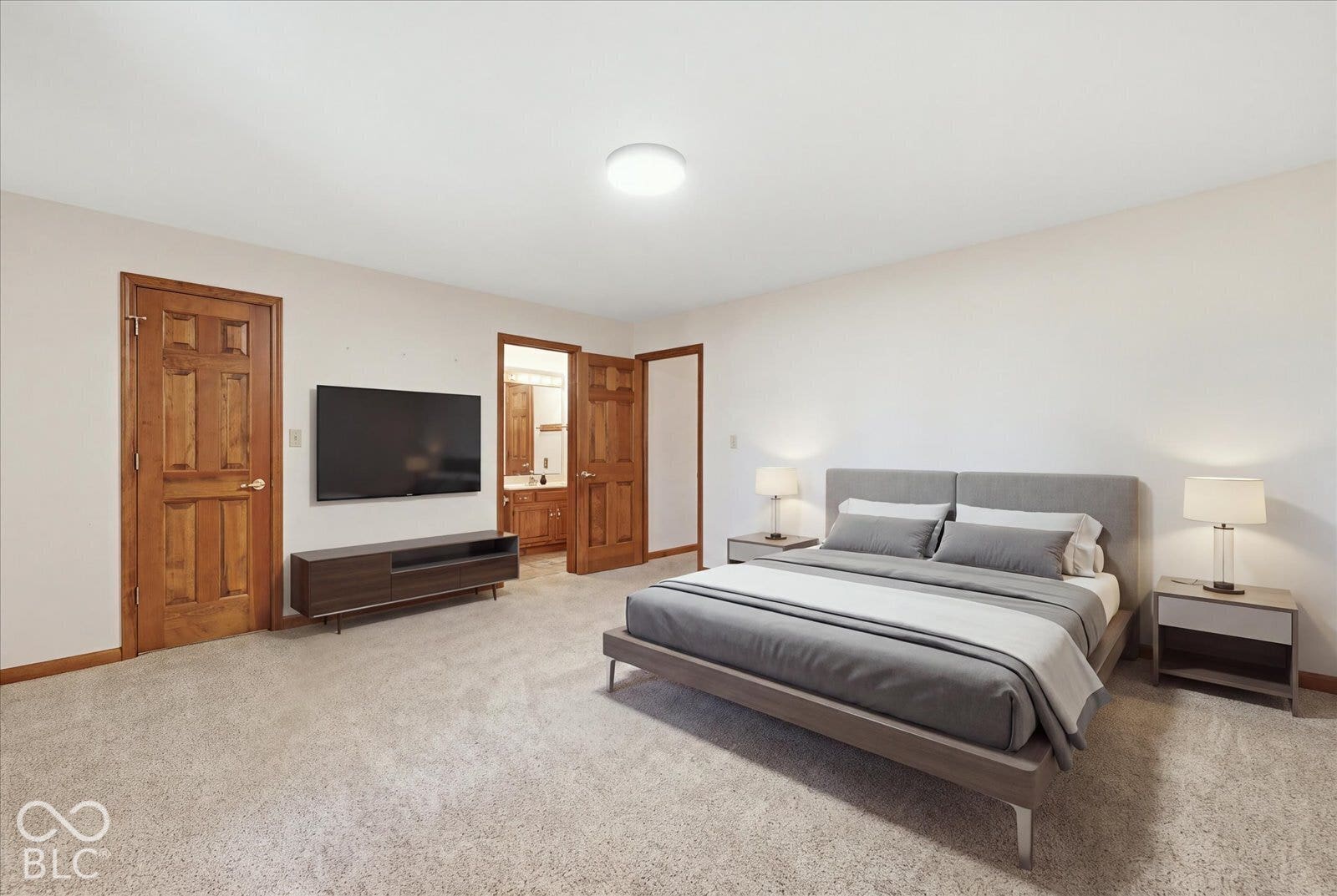 Virtually Altered - Neutral-toned wall-to-wall carpeting, solid wood interior doors with traditional millwork, and flush-mount overhead lighting